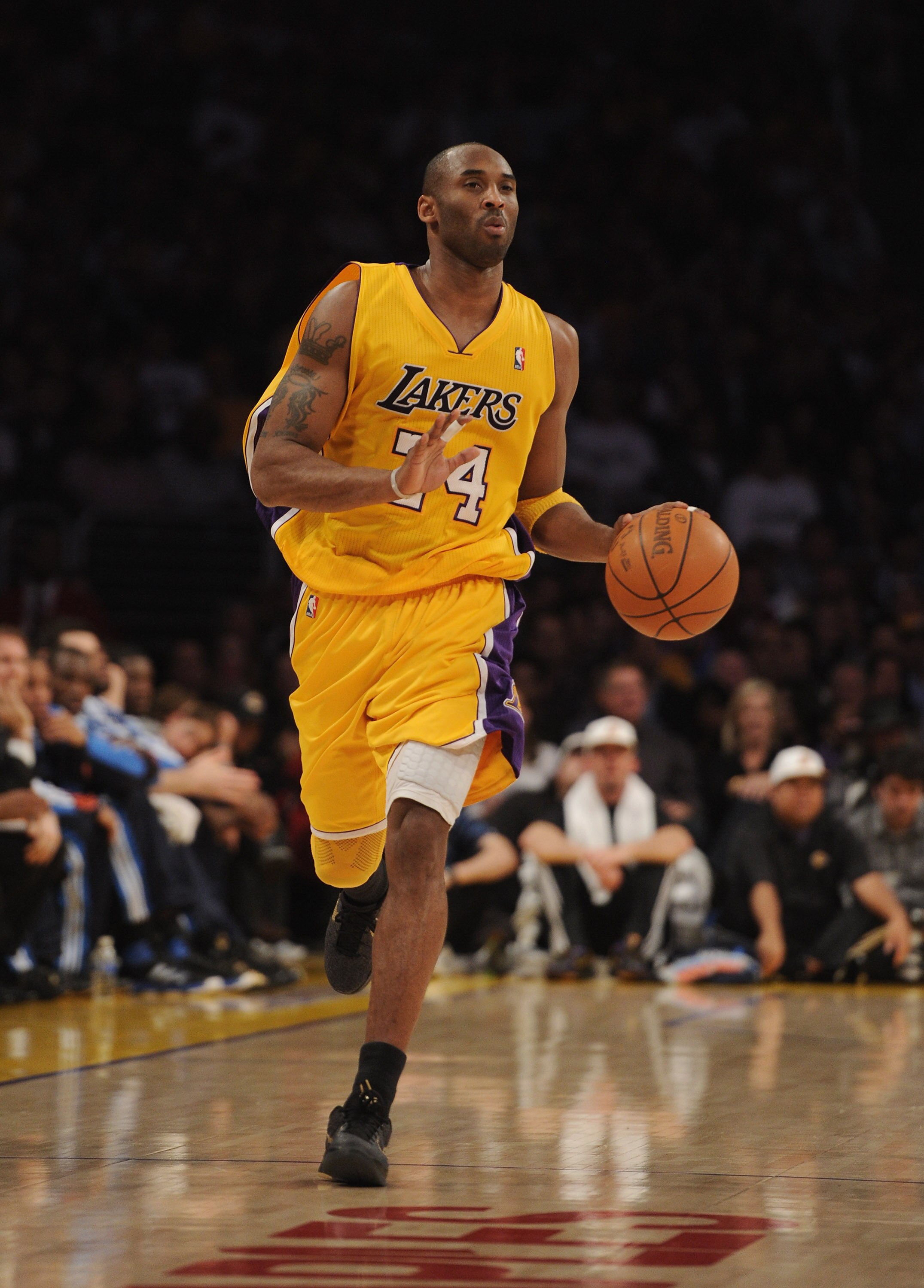 LOS ANGELES, CA - JANUARY 17:  Kobe Bryant #24 of the Los Angeles Lakers dribbles up court during the game against the Oklahoma City Thunder at the Staples Center on January 17, 2011 in Los Angeles, California.  (Photo by Harry How/Getty Images)   NOTE TO