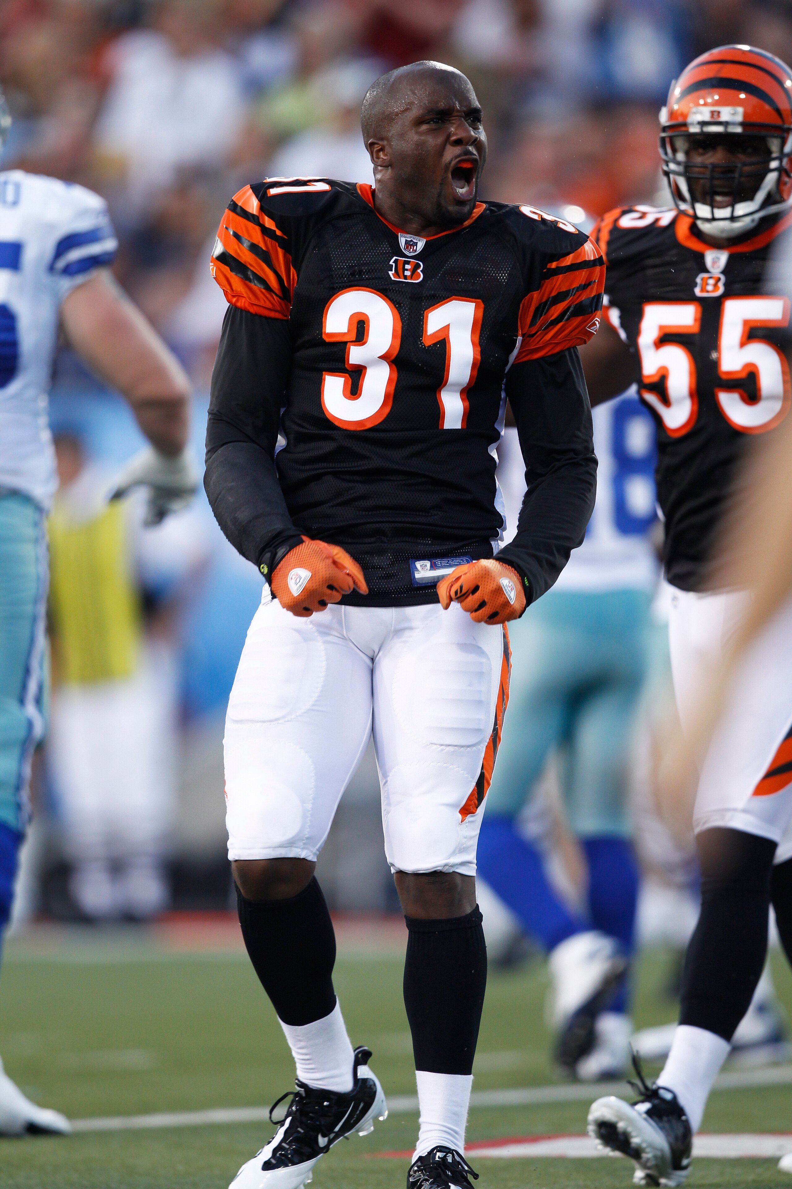 CANTON, OH - AUGUST 8: Roy Williams #31 of the Cincinnati Bengals celebrates after making a hit and losing his helmet against the Dallas Cowboys during the 2010 Pro Football Hall of Fame Game at the Pro Football Hall of Fame Field at Fawcett Stadium on Au CANTON, OH - AUGUST 8: Roy Williams #31 of the Cincinnati Bengals celebrates after making a hit and losing his helmet against the Dallas Cowboys during the 2010 Pro Football Hall of Fame Game at the Pro Football Hall of Fame Field at Fawcett Stadium on Au