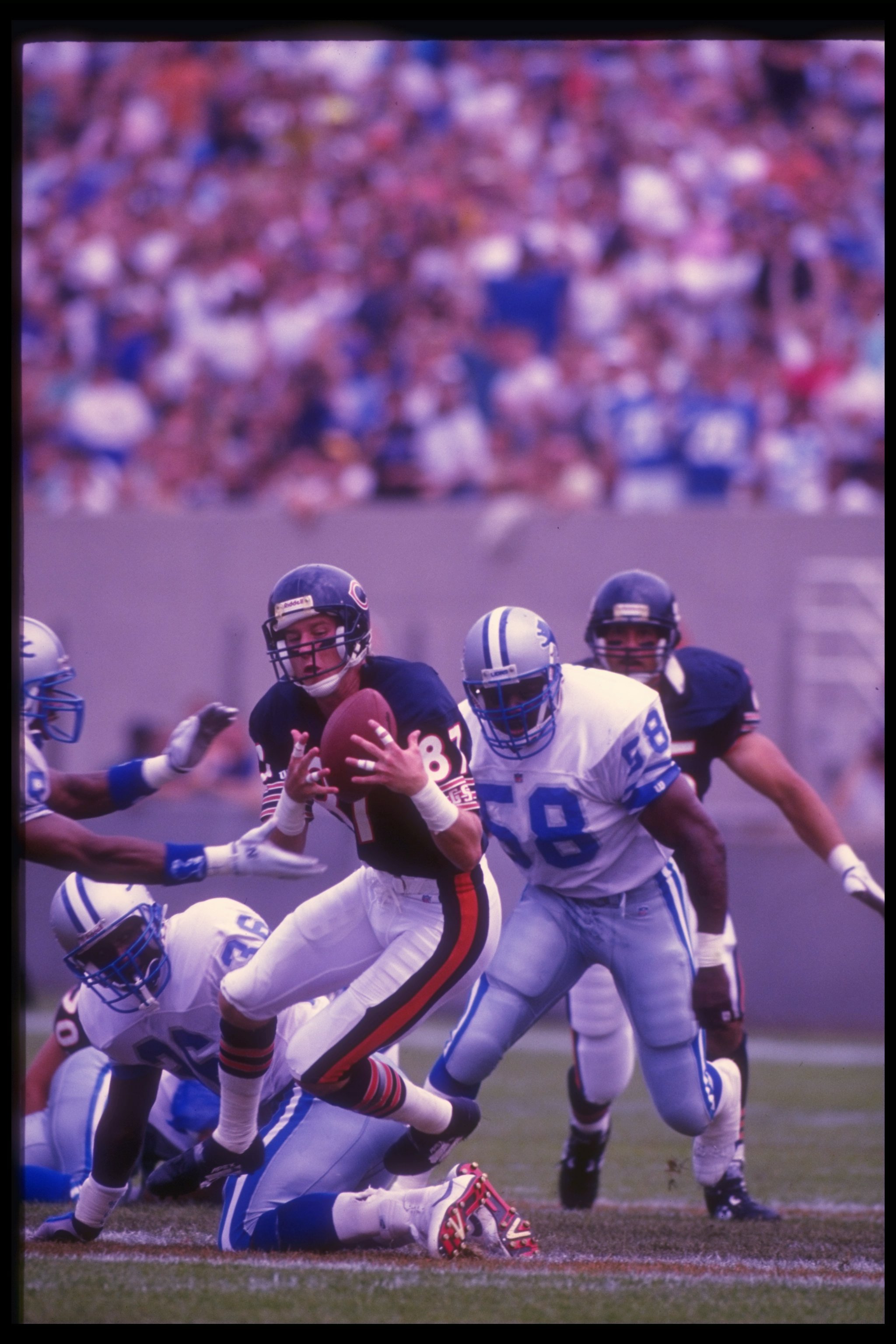Sep 1992:  Wide receiver Tom Waddle of the Chicago Bears (center) catches the ball during a game against the Detroit Lions at Soldier Field in Chicago, Illinois.  The Bears won the game, 27-24. Mandatory Credit: Jonathan Daniel  /Allsport