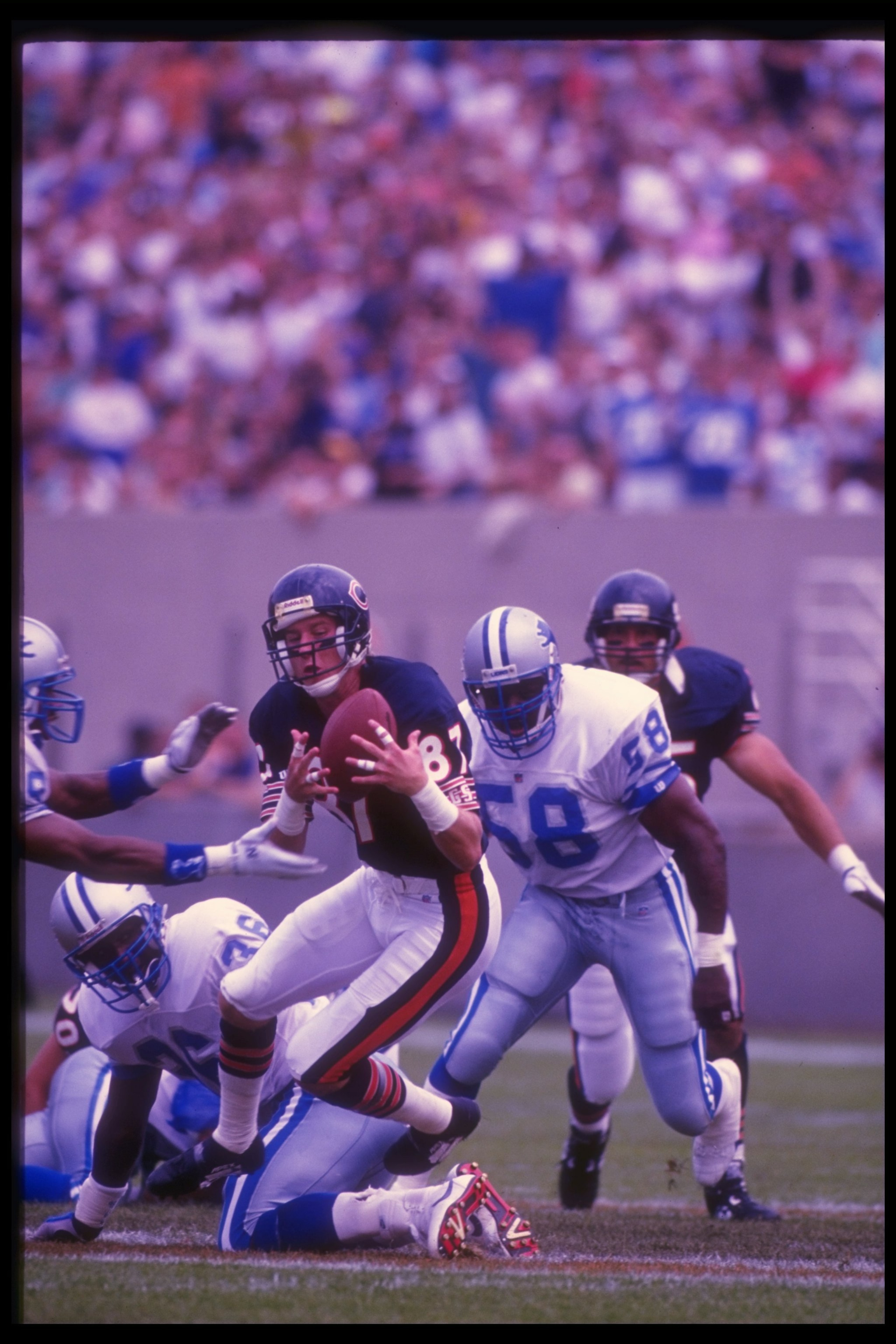 Sep 1992:  Wide receiver Tom Waddle of the Chicago Bears (center) catches the ball during a game against the Detroit Lions at Soldier Field in Chicago, Illinois.  The Bears won the game, 27-24. Mandatory Credit: Jonathan Daniel  /Allsport