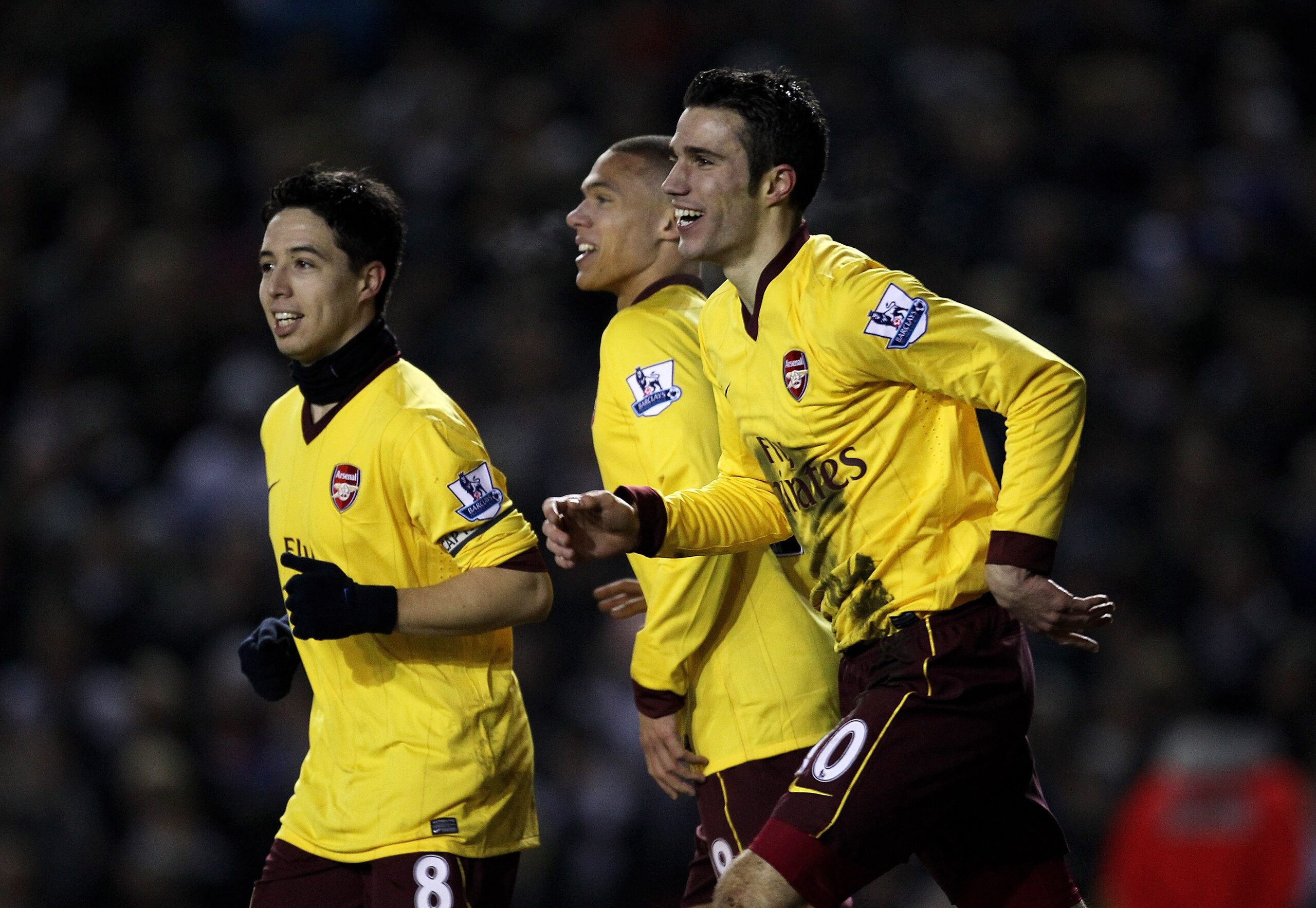 LEEDS, ENGLAND - JANUARY 19:  Robin van Persie of Arsenal celebrates scoring his team's third goal with team mates Samir Nasri (L) and Keiran Gibbs during the FA Cup sponsored by E.On Third Round Replay match between Leeds United and Arsenal at Elland Roa