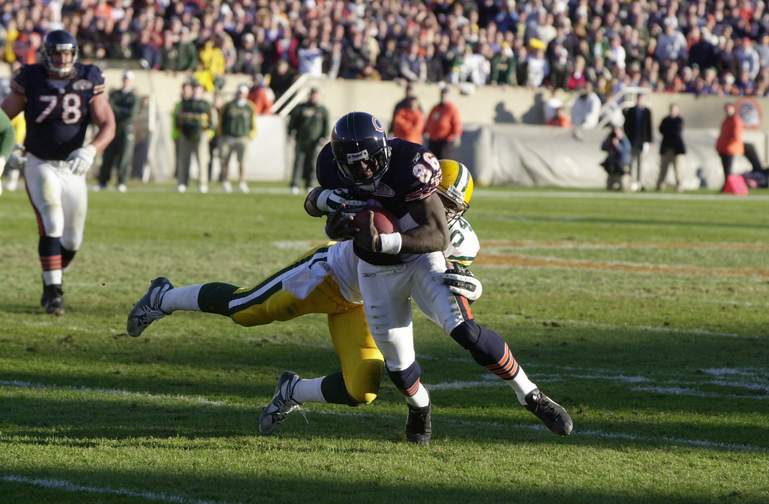 11 Nov 2001: Reciever Marty Booker #86 of the Chicago Bears is stopped short of a first down by linebacker Nate Wayne #54 of the Green Bay Packers during the game at Soldier Field in Chicago, Illinois. The Packers won 20-12. DIGITAL IMAGE. Mandatory Credi