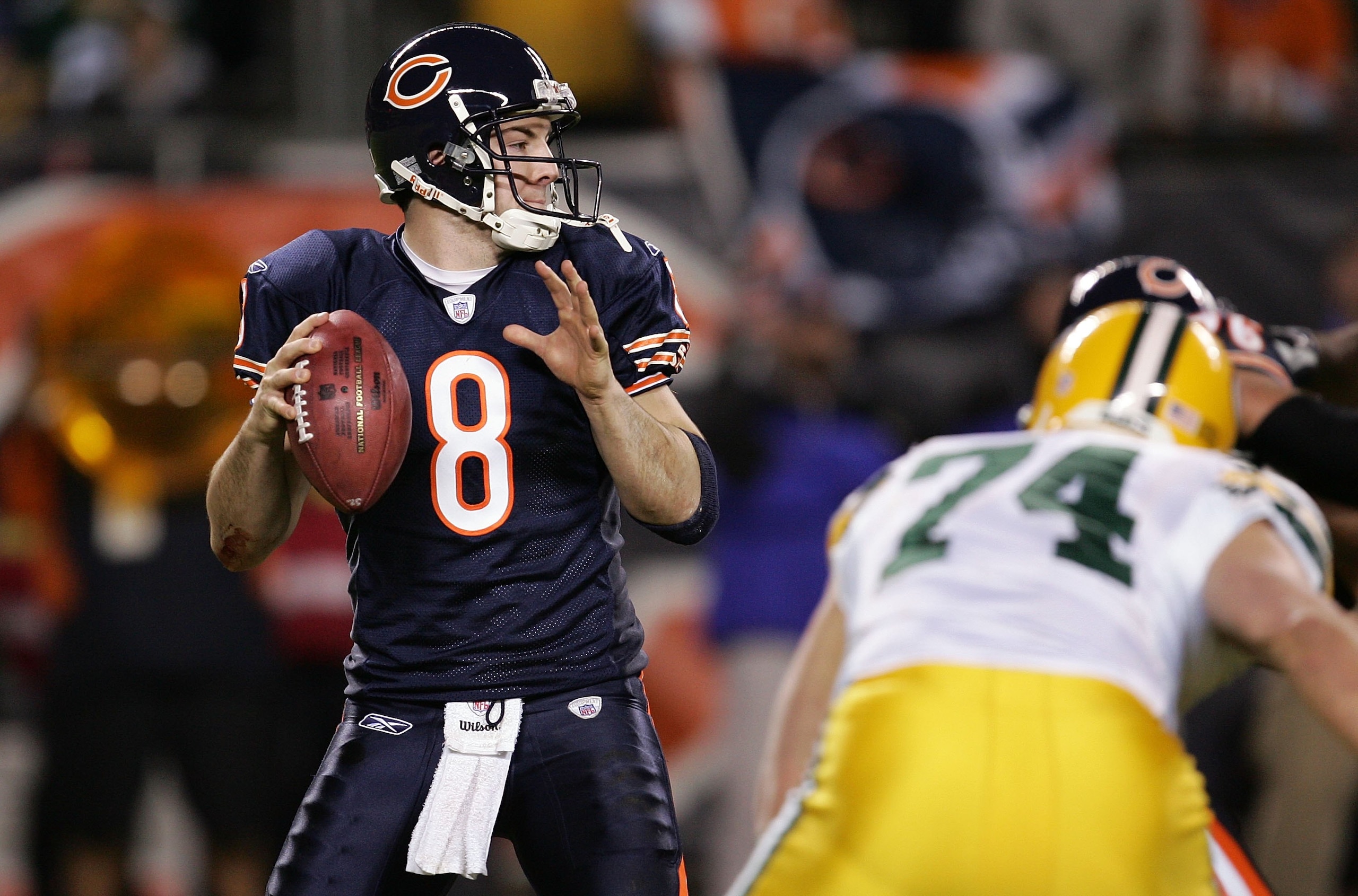 CHICAGO - DECEMBER 31:  Quarterback Rex Grossman #8 of the Chicago Bears looks to pass against defensive end Aaron Kampman #74 of the Green Bay Packers December 31, 2006 at Soldier Field in Chicago, Illinois. The Packers won 26-7.  (Photo by Jonathan Dani