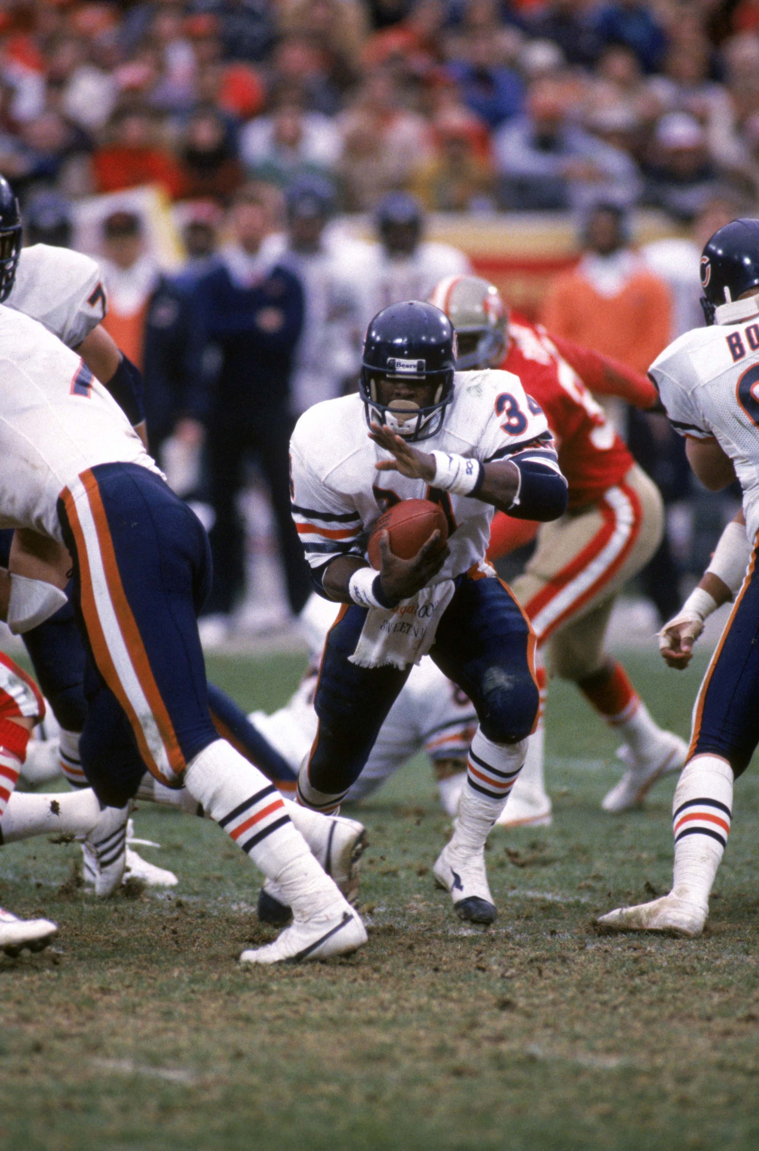 SAN FRANCISCO - JANUARY 6:  Running back Walter Payton #34 of the Chicago Bears runs with the ball during the 1984 NFC Championship Game against the San Francisco 49ers at Candlestick Park on January 6, 1985 in San Francisco, California.  The 49ers won 23