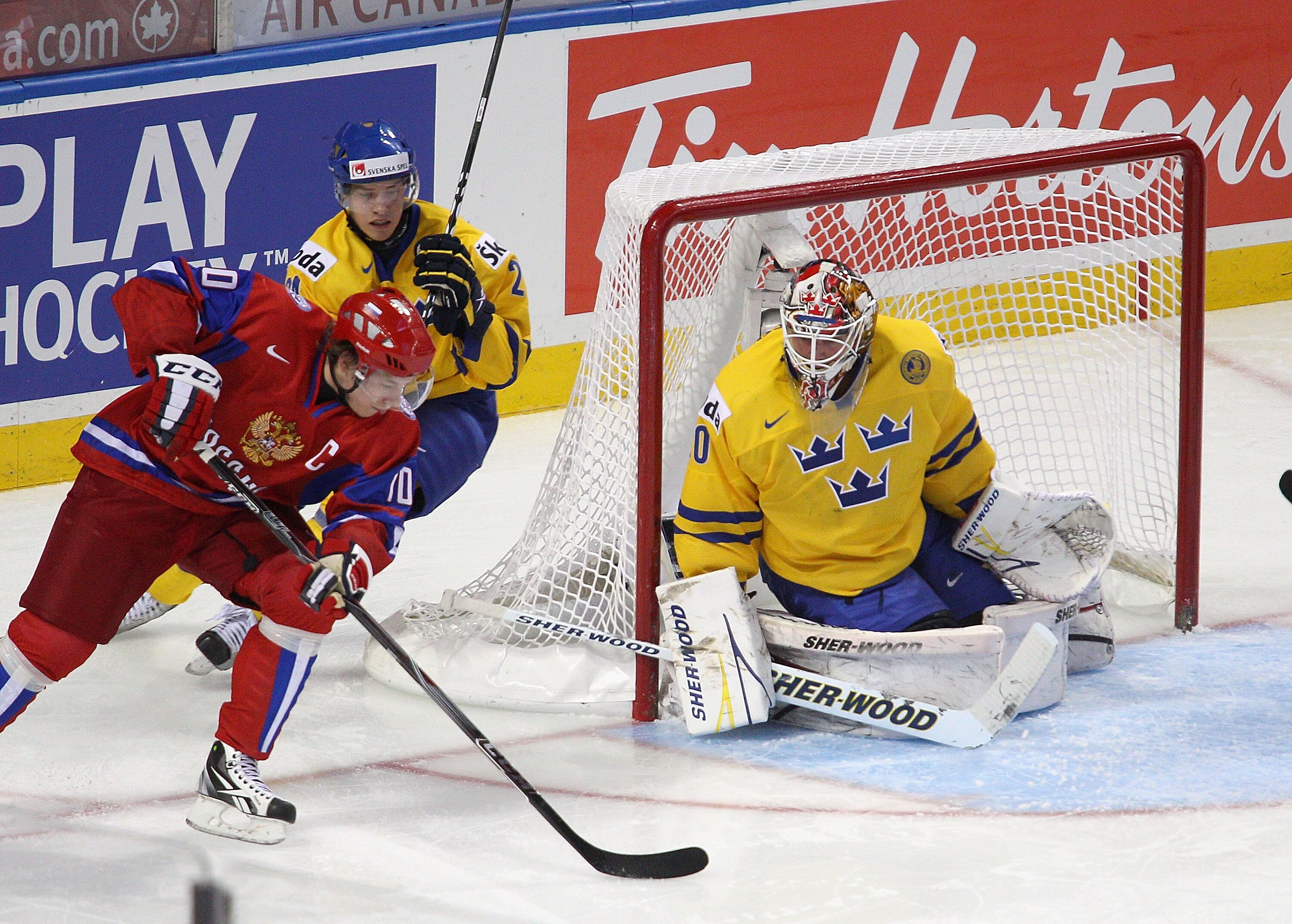 BUFFALO, NY - JANUARY 03: Vladimir Tarasenko #10 of Russia gets off a backhand shot against Robin Lehner #30 of Sweden  during the 2011 IIHF World U20 Championship Semi Final game between Sweden and Russia on January 3, 2011 in Buffalo, New York.  (Photo