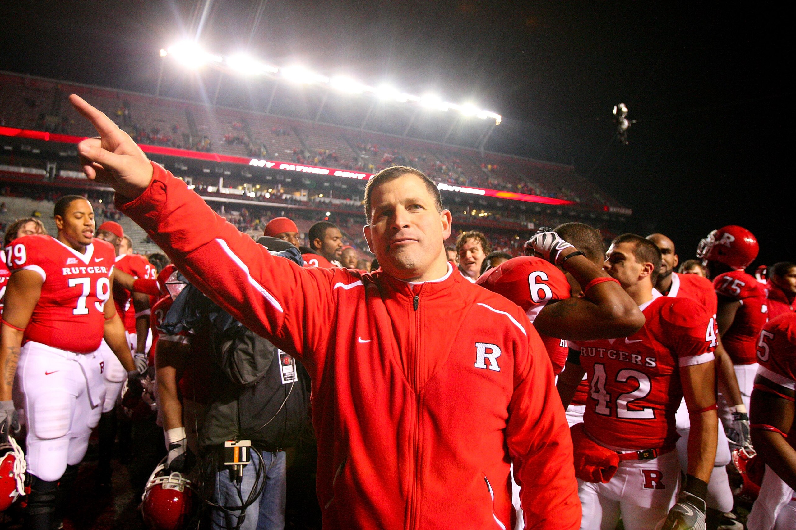 PISCATAWAY, NJ - DECEMBER 04:  Greg Schiano head coach of the Rutgers Scarlet Knights celebrates victory over the Louisville Cardinals at Rutgers Stadium on December 4, 2008 in Piscataway, New Jersey.  (Photo by Jim McIsaac/Getty Images)