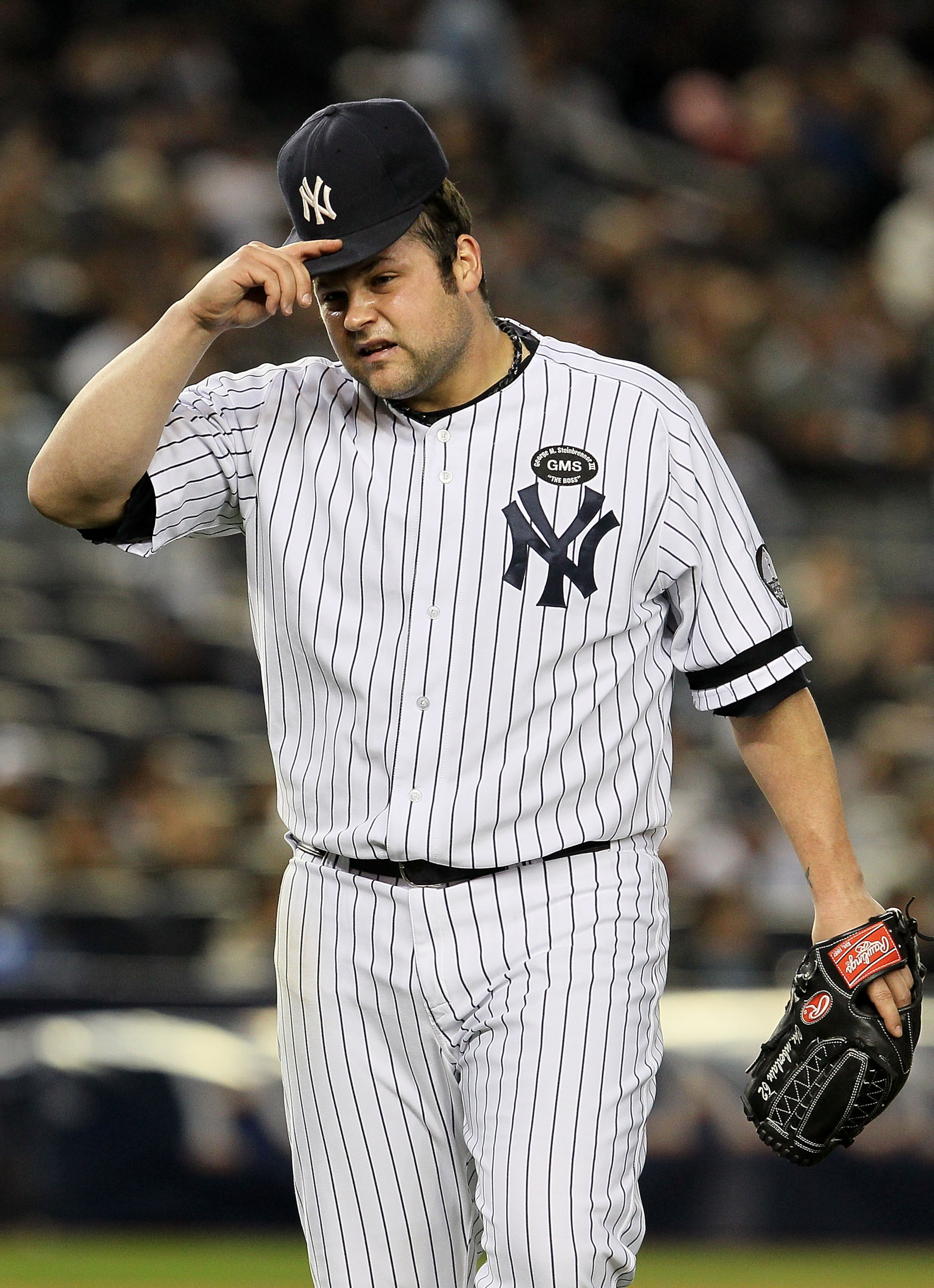 NEW YORK - OCTOBER 19: Joba Chamberlain #62 of the New York Yankees reacts as he walks back to the dugout at the end of the top of the eighth inning against the Texas Rangers in Game Four of the ALCS during the 2010 MLB Playoffs at Yankee Stadium on Octo NEW YORK - OCTOBER 19: Joba Chamberlain #62 of the New York Yankees reacts as he walks back to the dugout at the end of the top of the eighth inning against the Texas Rangers in Game Four of the ALCS during the 2010 MLB Playoffs at Yankee Stadium on Octo