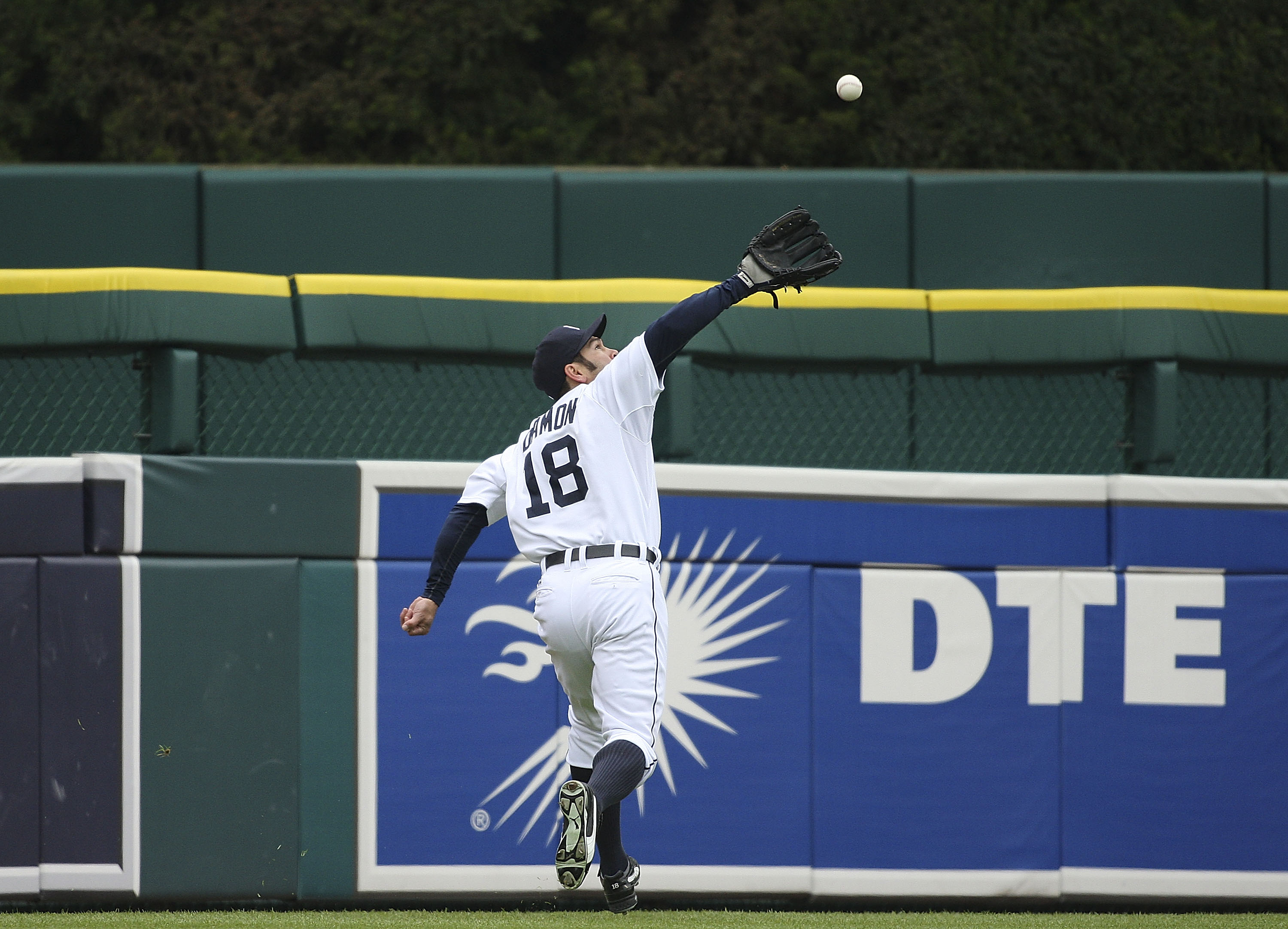 DETROIT - MAY 12: Johnny Damon #18 of the Detroit Tigers catches a line drive off the bat of Derek Jeter #2 of the New York Yankees (not in photo) in the fifth inning against the New York Yankees during the game on May 12, 2010 at Comerica Park in Detroit