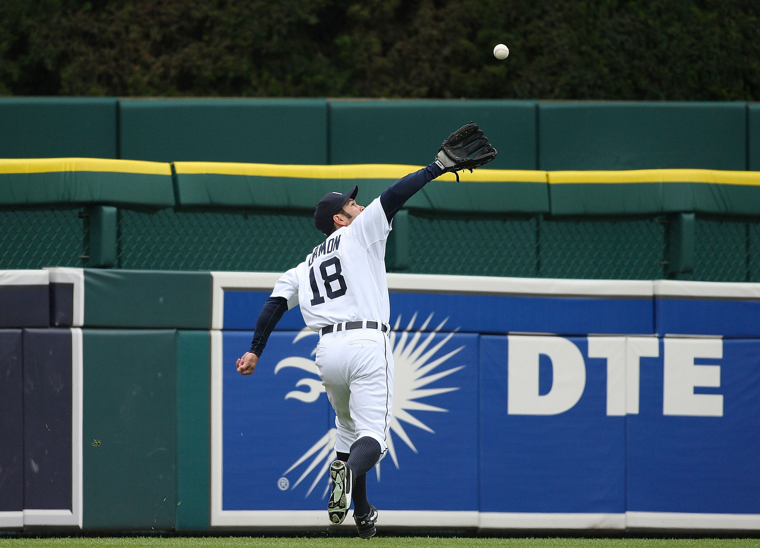 DETROIT - MAY 12: Johnny Damon #18 of the Detroit Tigers catches a line drive off the bat of Derek Jeter #2 of the New York Yankees (not in photo) in the fifth inning against the New York Yankees during the game on May 12, 2010 at Comerica Park in Detroit DETROIT - MAY 12: Johnny Damon #18 of the Detroit Tigers catches a line drive off the bat of Derek Jeter #2 of the New York Yankees (not in photo) in the fifth inning against the New York Yankees during the game on May 12, 2010 at Comerica Park in Detroit