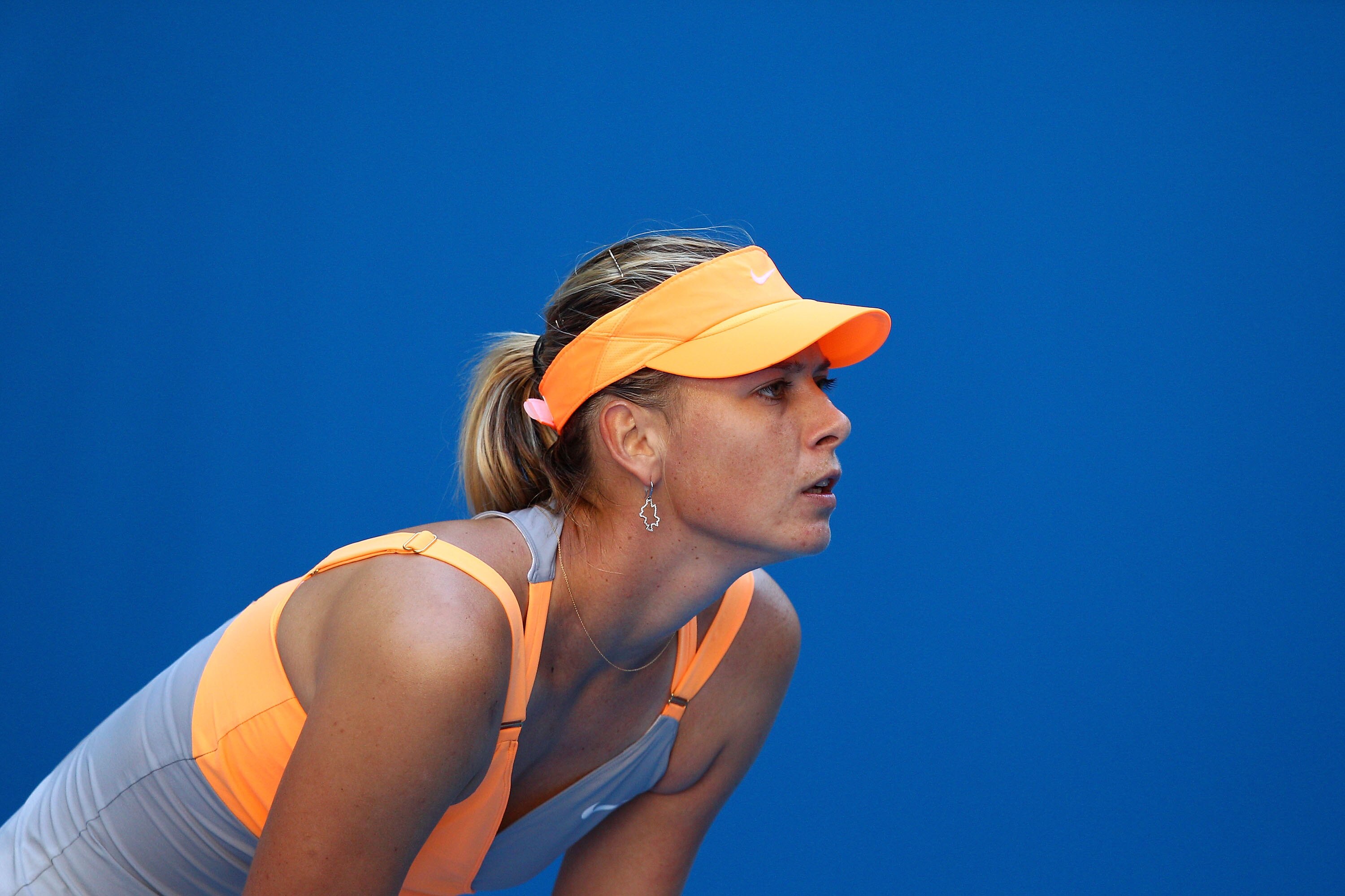 MELBOURNE, AUSTRALIA - JANUARY 19:  Maria Sharapova of Russia prepares to receive a serve in her second round match against Virginie Razzano of France during day three of the 2011 Australian Open at Melbourne Park on January 19, 2011 in Melbourne, Austral