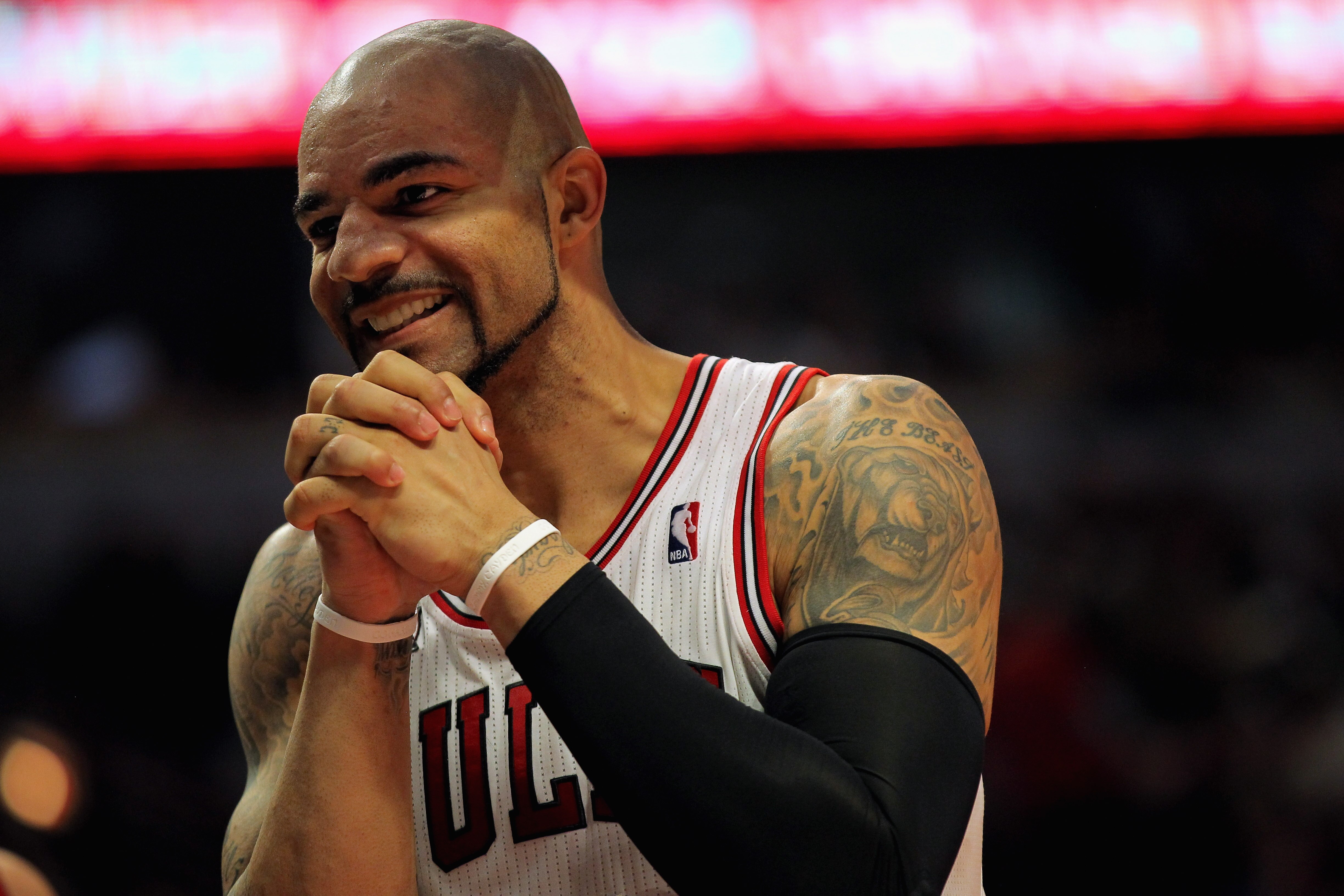 CHICAGO, IL - JANUARY 15:  Carlos Boozer #5 of the Chicago Bulls reacts after a play against the Miami Heat at the United Center on January 15, 2011 in Chicago, Illinois. NOTE TO USER: User expressly acknowledges and agrees that, by downloading and or usi