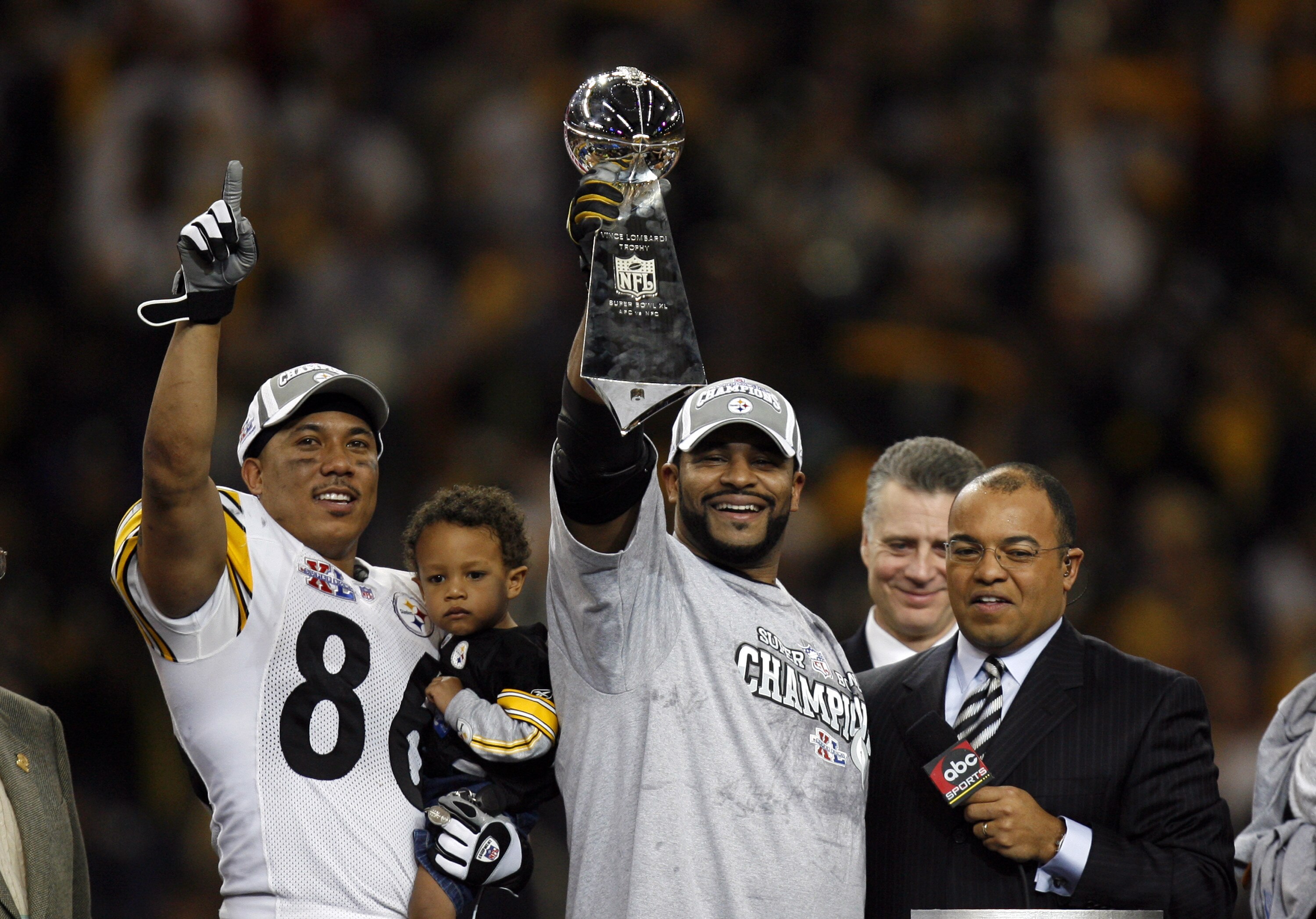 Hines Ward and Jerome Bettis celebrate with the Vince Lombardi Trophy after winning Super Bowl XL between the Pittsburgh Steelers and Seattle Seahawks at Ford Field in Detroit, Michigan on February 5, 2006. (Photo by Allen Kee/Getty Images)
