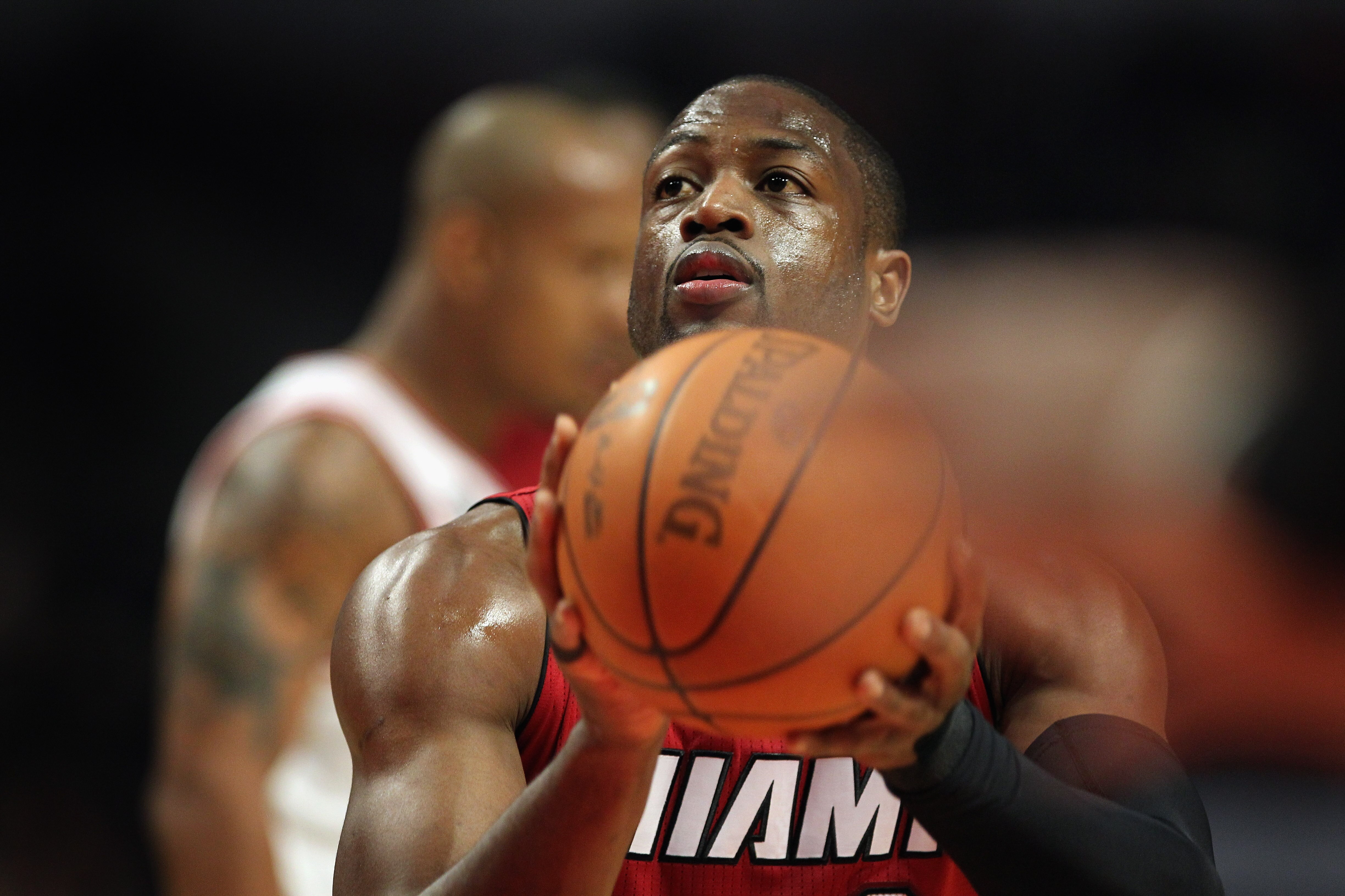 CHICAGO, IL - JANUARY 15:  Dwyane Wade #3 of the Miami Heat takes a free throw against the Chicago Bulls at the United Center on January 15, 2011 in Chicago, Illinois. The Bulls defeated the Heat 99-96. NOTE TO USER: User expressly acknowledges and agrees