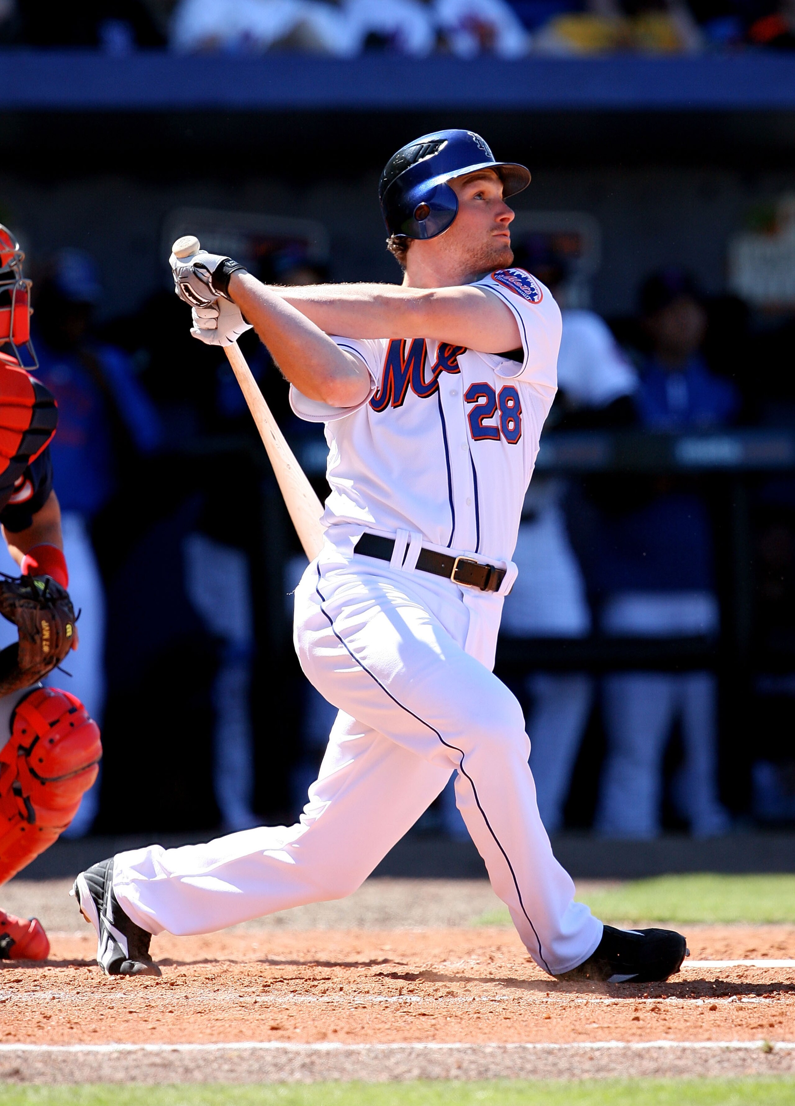 PORT ST. LUCIE, FL - MARCH 07:  First baseman Daniel Murphy #28 of the New York Mets follows his long fly ball to center field against the Washington Nationals at Tradition Field on March 7, 2010 in Port St. Lucie, Florida.  (Photo by Doug Benc/Getty Imag