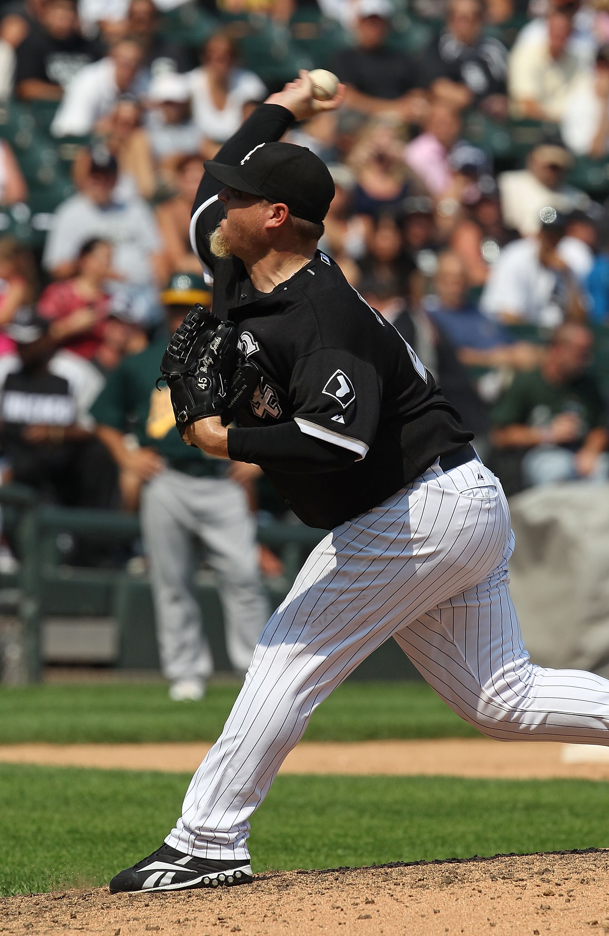 CHICAGO - AUGUST 01: Bobby Jenks #45 of the Chicago White Sox pitches in the 9th inning against the Oakland Athletics at U.S. Cellular Field on August 1, 2010 in Chicago, Illinois. The White Sox defeated the Athletics 4-1. (Photo by Jonathan Daniel/Getty