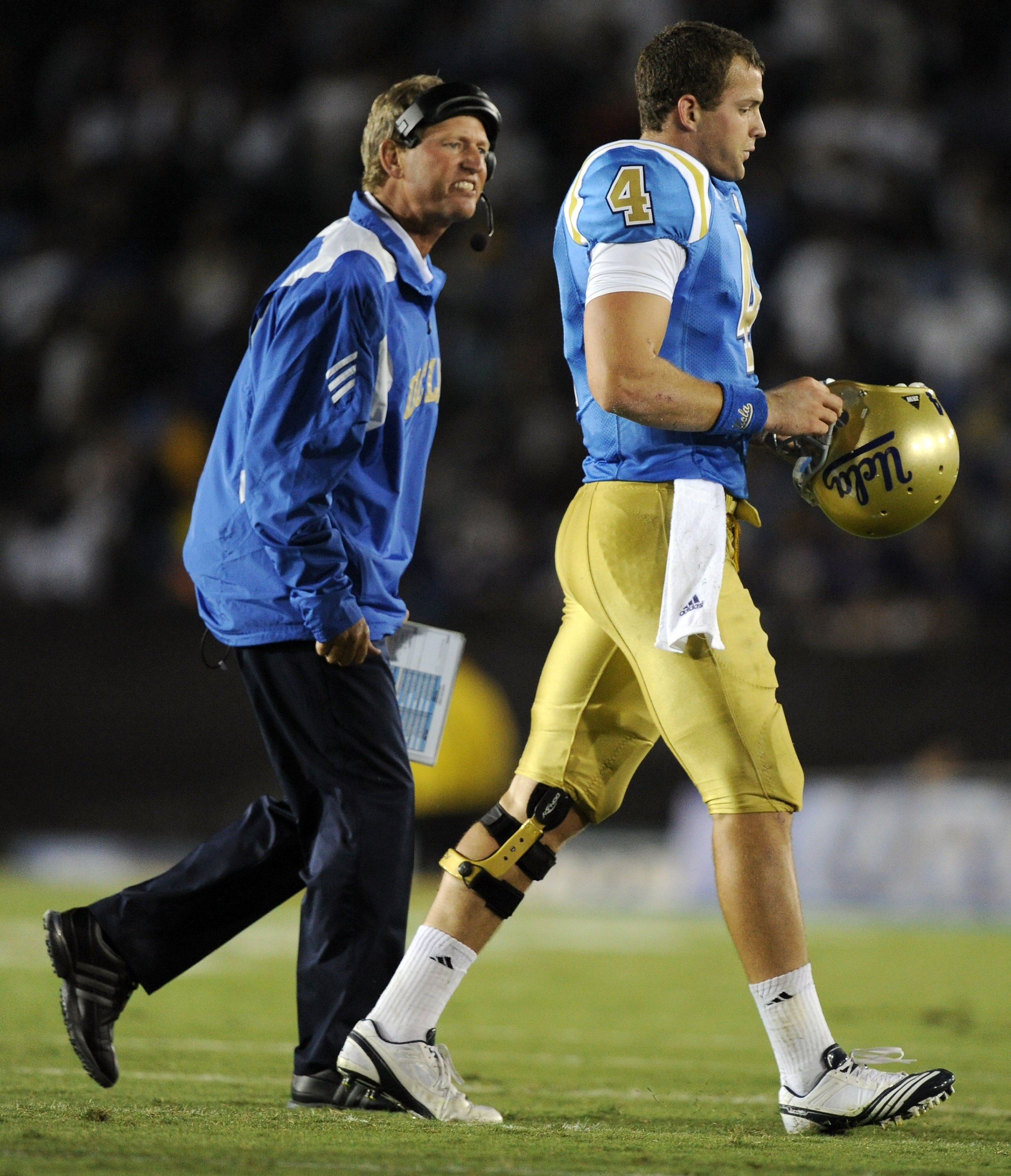 PASADENA, CA - SEPTEMBER 11:  Head Coach Rick Neuheisel of UCLA reacts to Kevin Prince #4 after his intercepted pass during the second quarter against Stanford at Rose Bowl on September 11, 2010 in Pasadena, California.  (Photo by Harry How/Getty Images)
