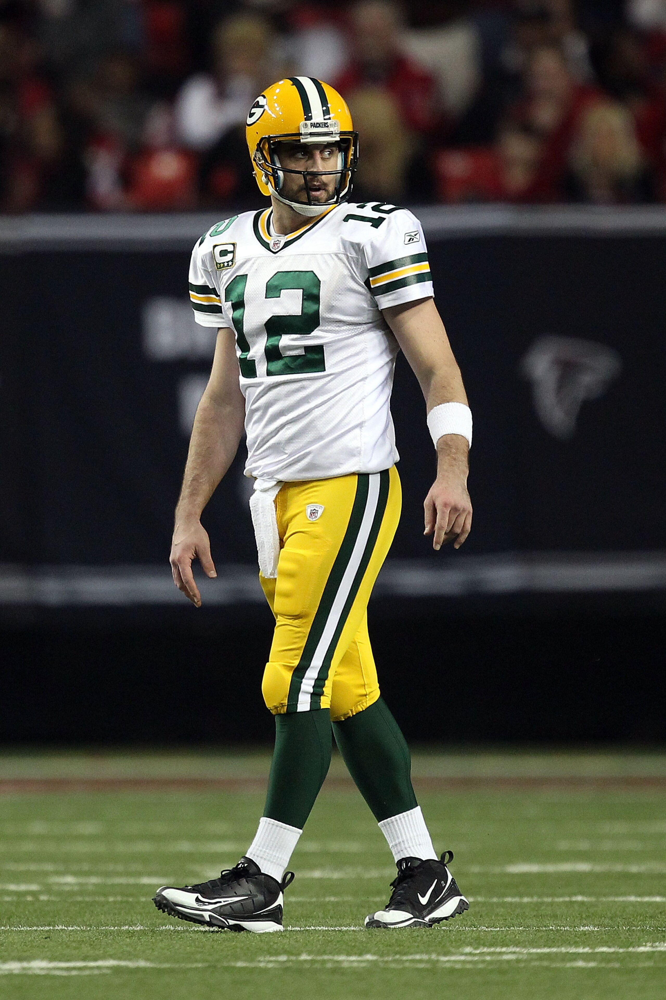 ATLANTA, GA - JANUARY 15:  Aaron Rodgers #12 of the Green Bay Packers looks on against the Atlanta Falcons during their 2011 NFC divisional playoff game at Georgia Dome on January 15, 2011 in Atlanta, Georgia. The Packers won 48-21.  (Photo by Streeter Le