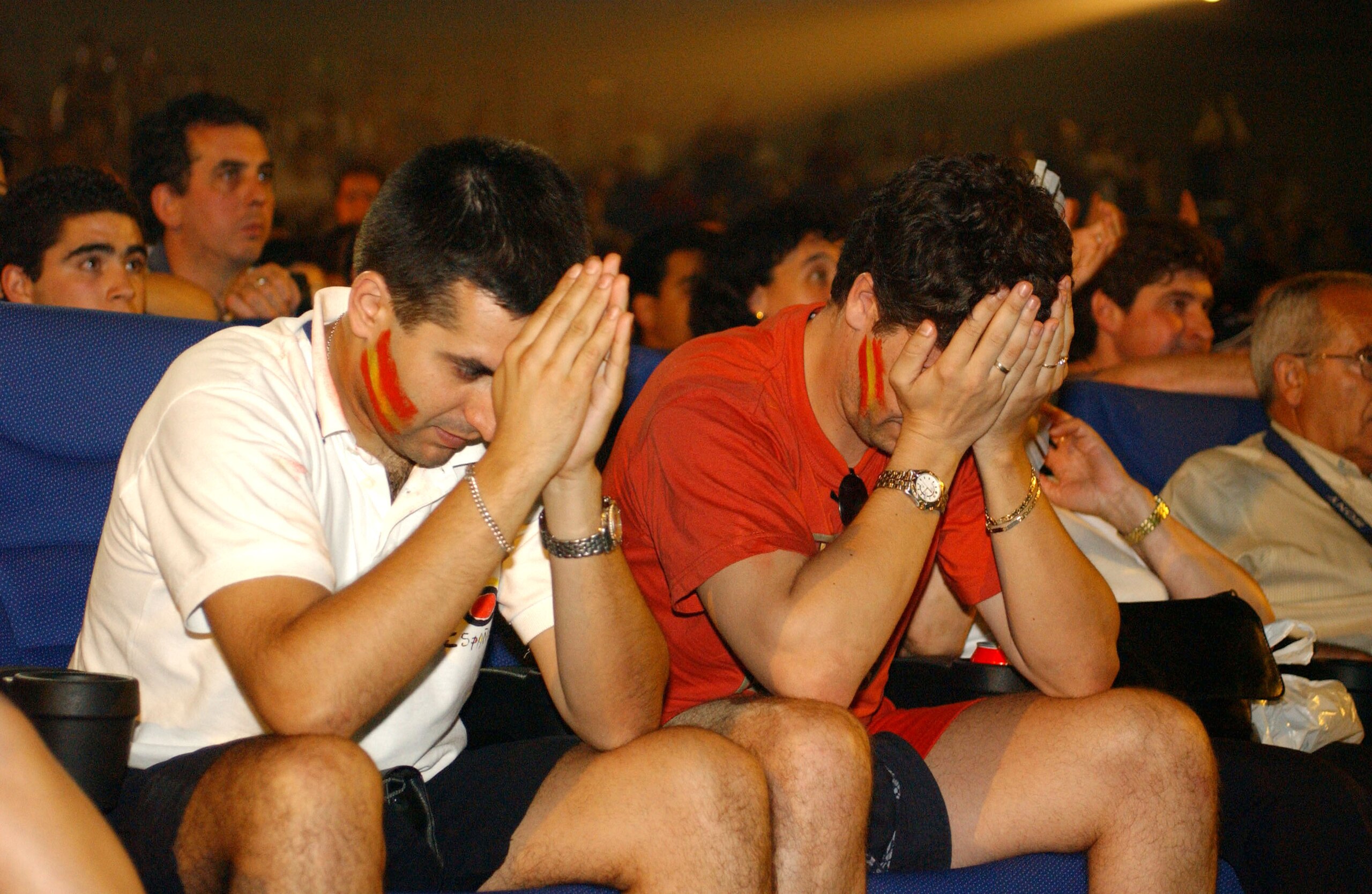 MADRID, SPAIN - JUNE 16:  Spanish soccer fans wait in anticipation for news on Spain's national soccer team June 16, 2002 in Madrid, Spain. The Spanish team qualified for the 2002 Federation Internationale de Football Association (FIFA) World Cup quarter