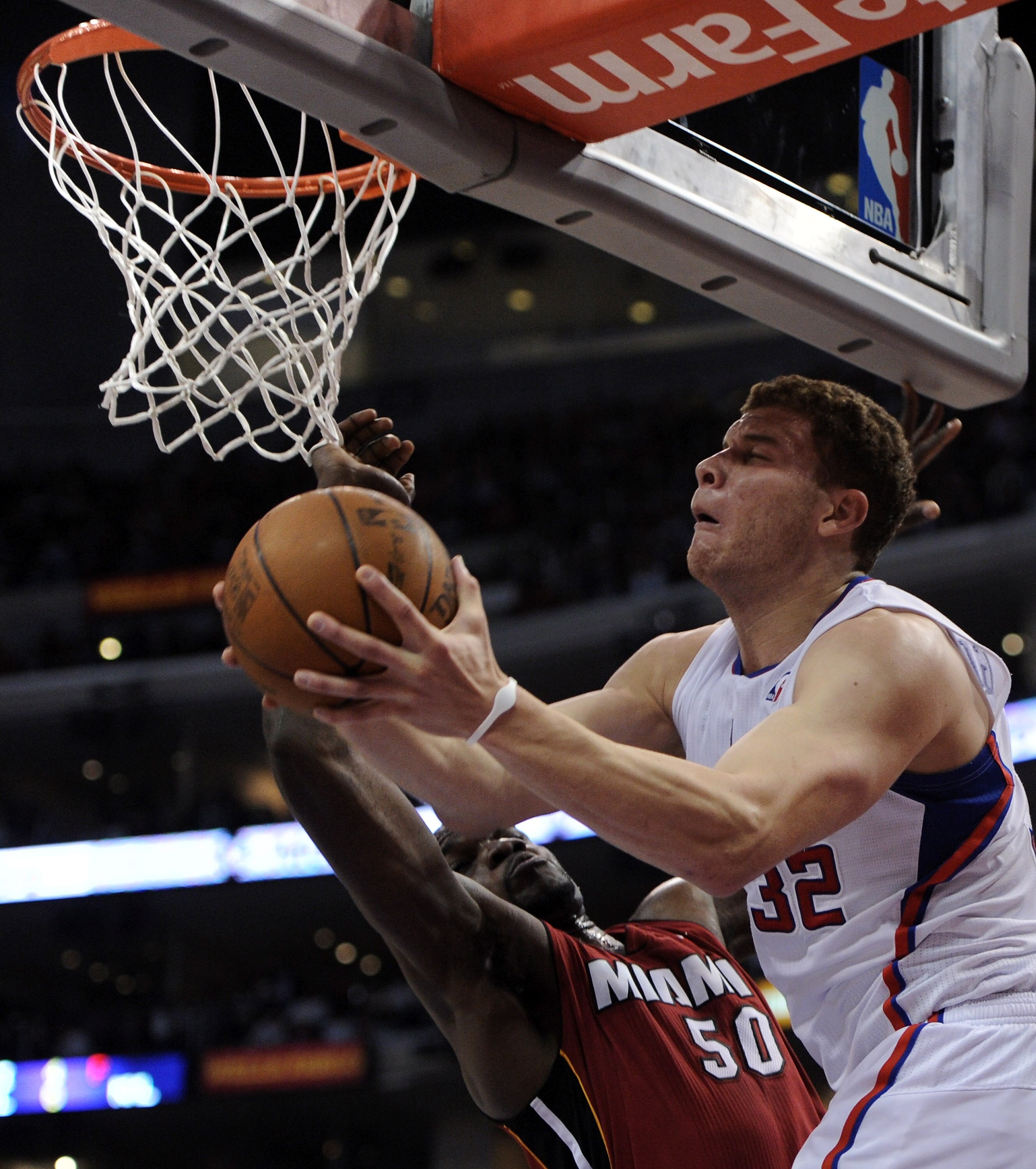 LOS ANGELES, CA - JANUARY 12:  Blake Griffin #32 of the Los Angeles Clippers scores on a reverse layup past Joel Anthony #50 of the Miami Heat at Staples Center on January 12, 2011 in Los Angeles, California.  NOTE TO USER: User expressly acknowledges and