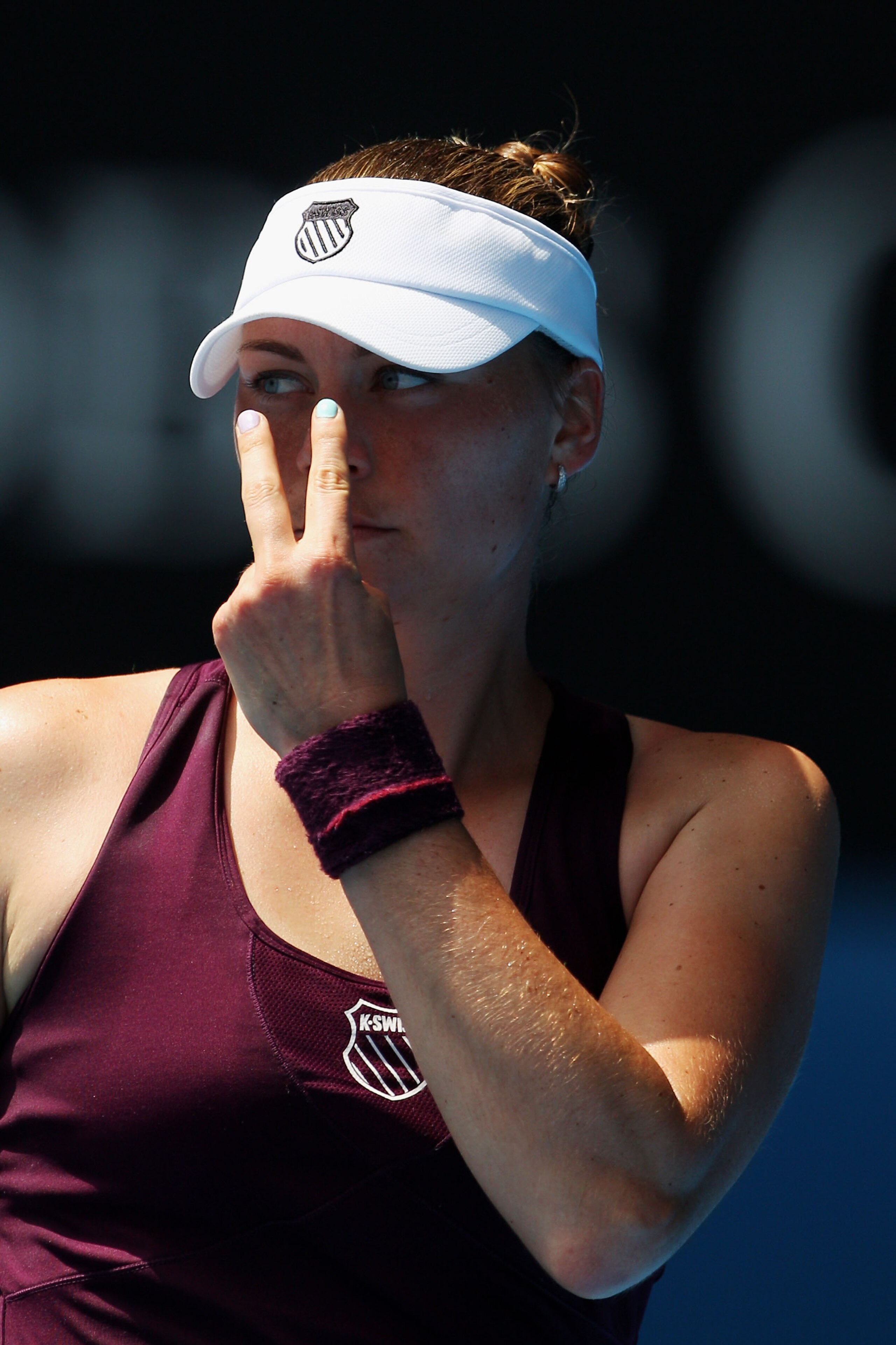 MELBOURNE, AUSTRALIA - JANUARY 22:  Vera Zvonareva of Russia points to her eyes in her third round match against Lucie Safarova of the Czech Republic during day six of the 2011 Australian Open at Melbourne Park on January 22, 2011 in Melbourne, Australia.