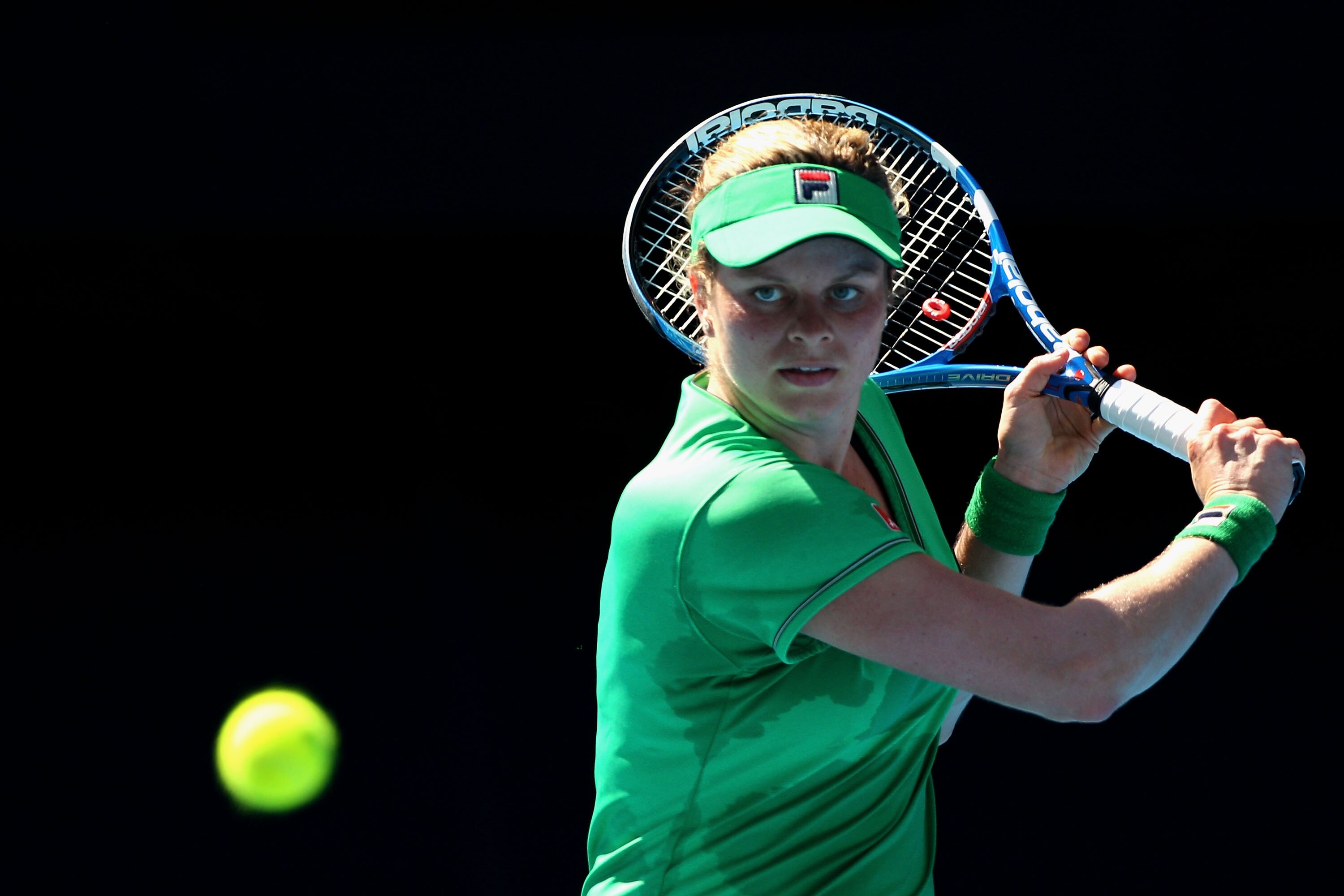 MELBOURNE, AUSTRALIA - JANUARY 22:  Kim Clijsters of Belgium plays a backhand in her third round match against Alize Cornet of France during day six of the 2011 Australian Open at Melbourne Park on January 22, 2011 in Melbourne, Australia.  (Photo by Ryan