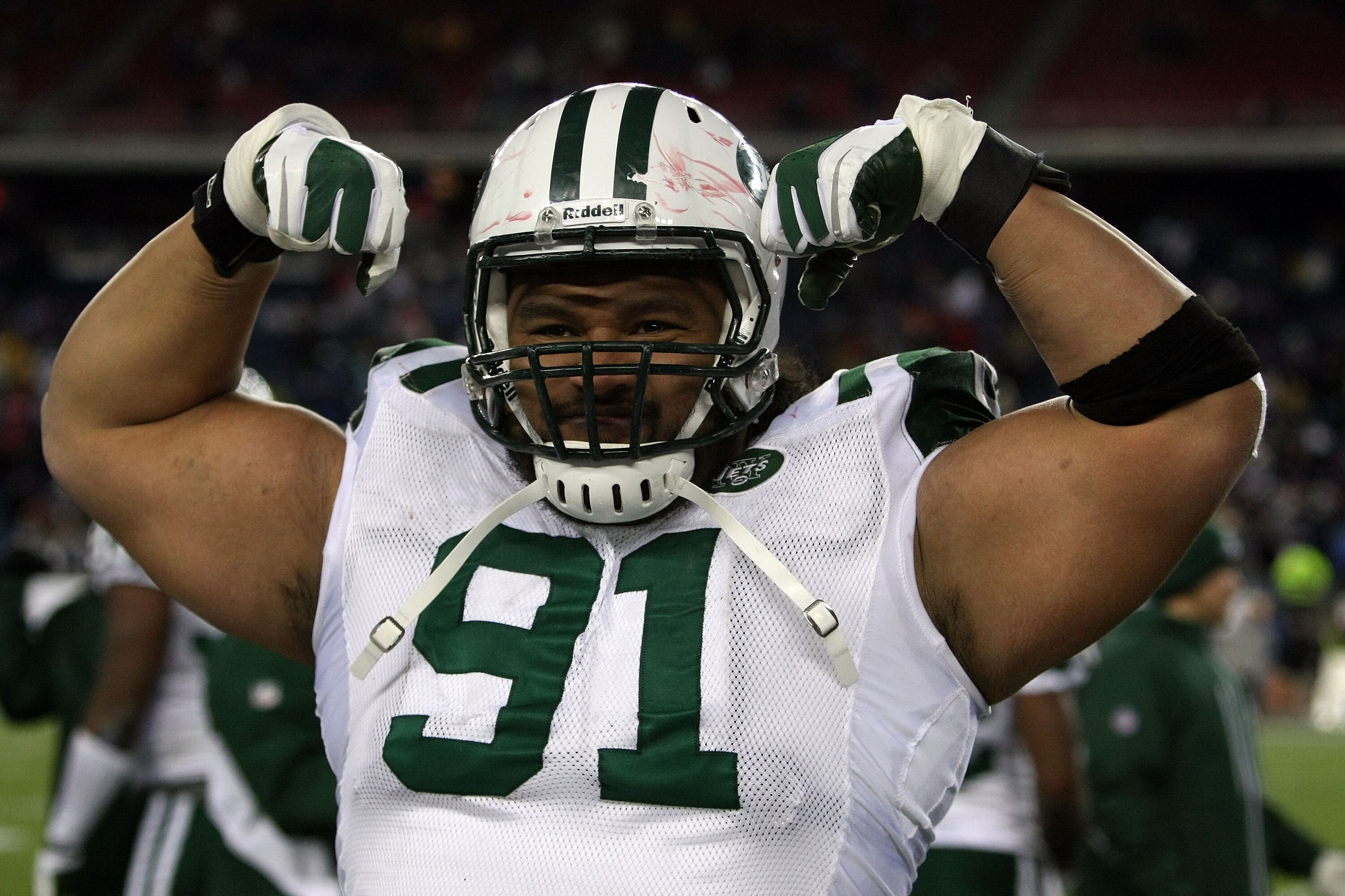 FOXBORO, MA - JANUARY 16:  Sione Pouha #91 of the New York Jets celebrates on his way to defeating the New England Patriots 28 to 21 victory over the New England Patriots during their 2011 AFC divisional playoff game at Gillette Stadium on January 16, 201