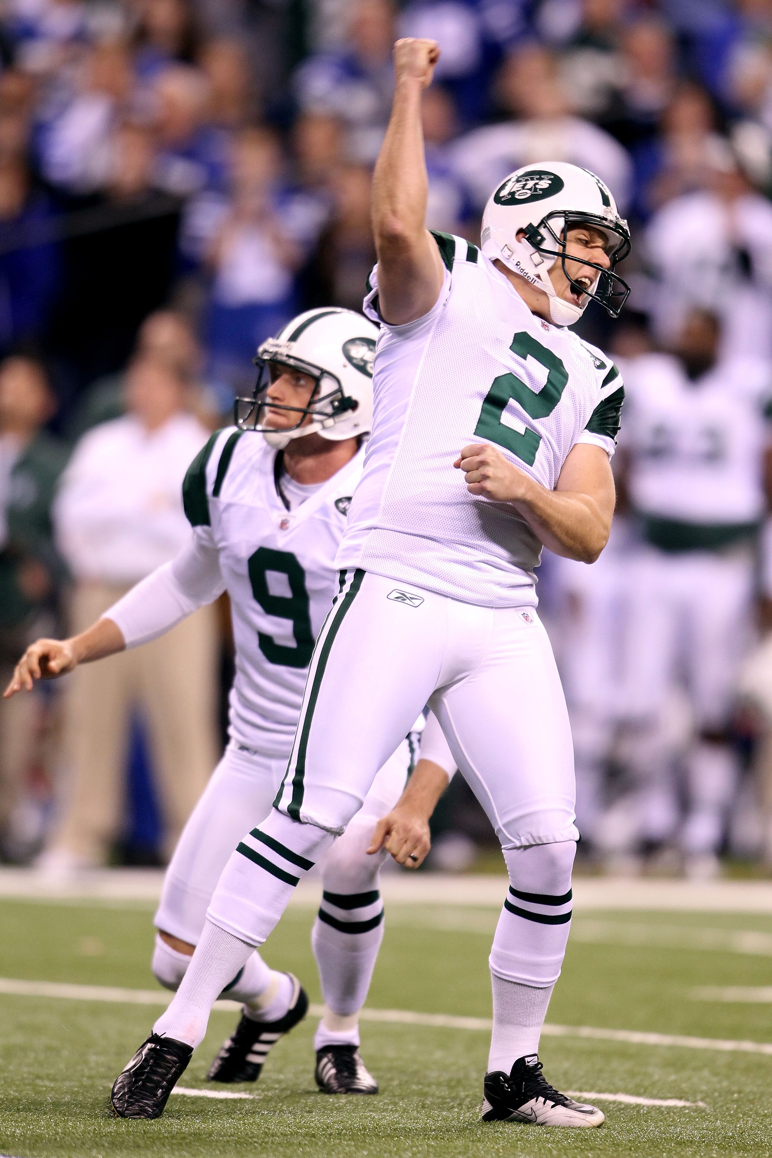 INDIANAPOLIS, IN - JANUARY 08:  Place kicker Nick Folk #2 and Steve Weatherford #9 of the New York Jets celebrates after Folk successfully kicked a game-winning a 32-yard field goal in the fourth quarter to win 17-16 against the Indianapolis Colts during