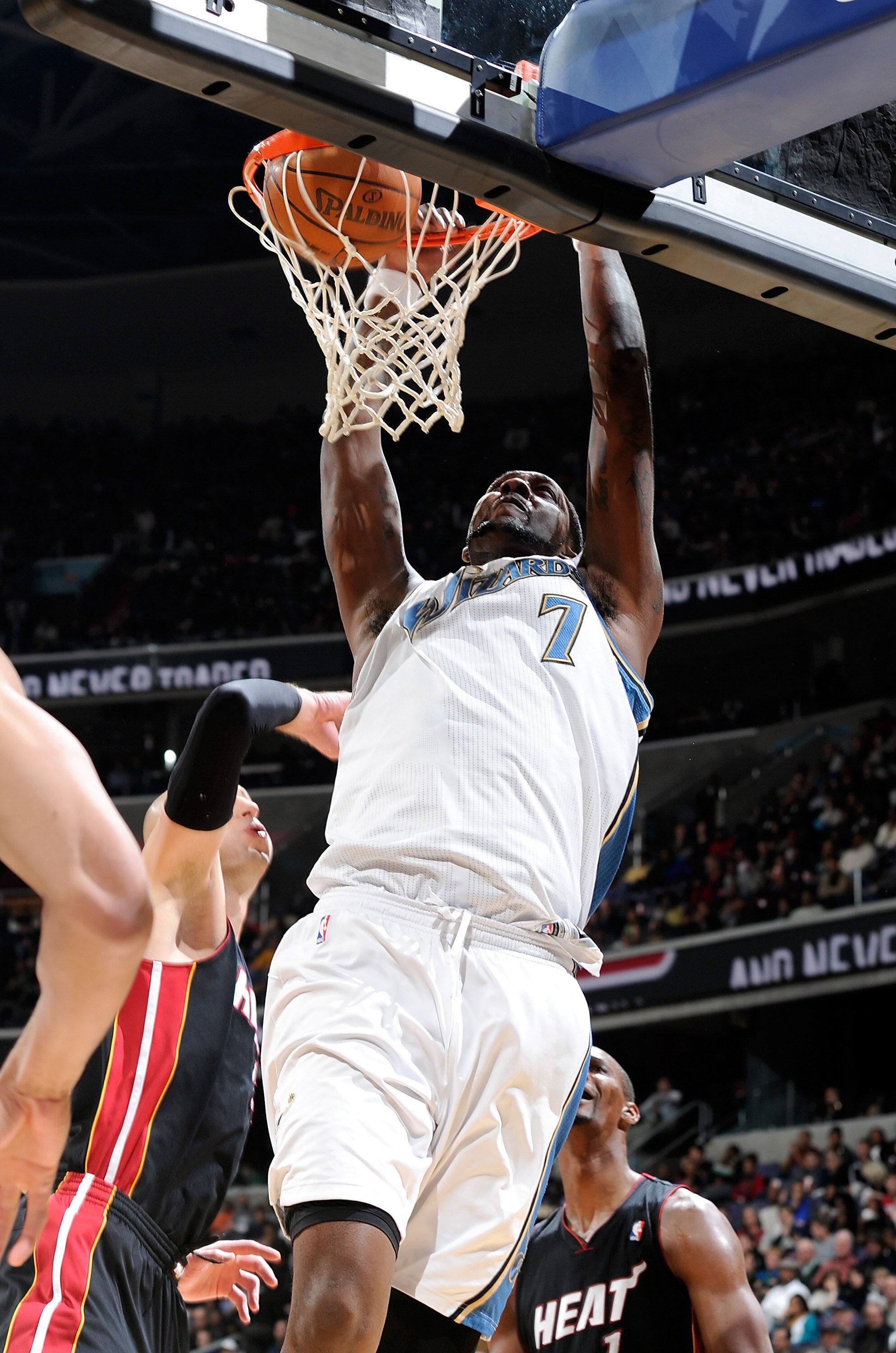 WASHINGTON, DC - DECEMBER 18:  Andray Blatche #7 of the Washington Wizards dunks the ball against the Miami Heat at the Verizon Center on December 18, 2010 in Washington, DC. NOTE TO USER: User expressly acknowledges and agrees that, by downloading and or