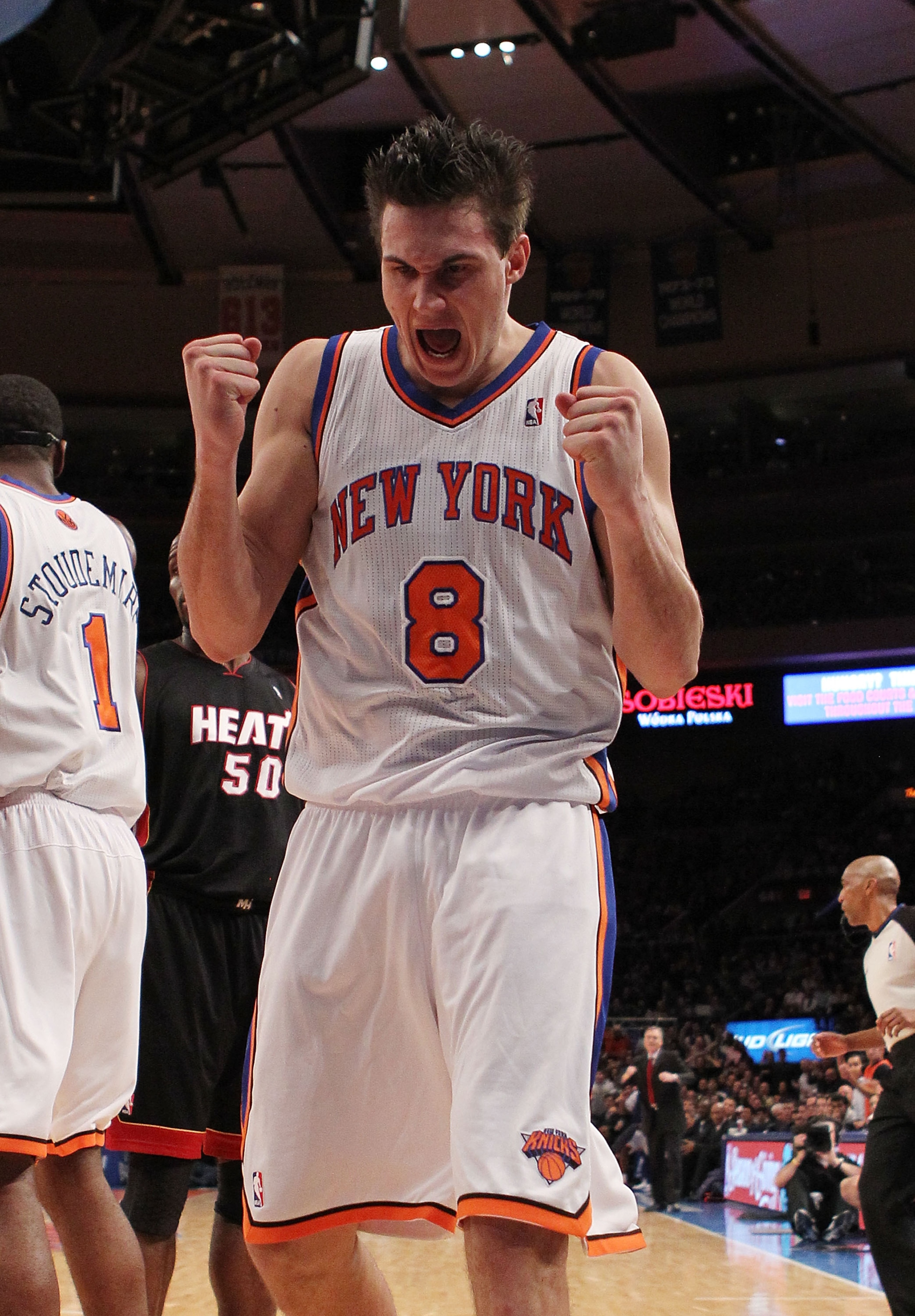 NEW YORK, NY - DECEMBER 17:  Danilo Gallinari #8 of the New York Knicks celebrates knocking the ball out of the hands of LeBron James #6 of the Miami Heat at Madison Square Garden on December 17, 2010 in New York City. NOTE TO USER: User expressly acknowl