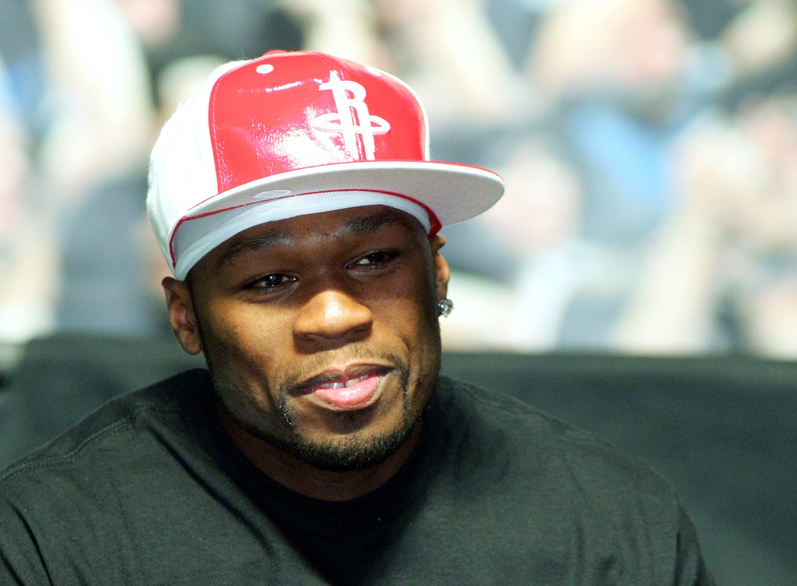 LAS VEGAS - MAY 05:  Rapper 50 Cent listens during a news conference after Floyd Mayweather Jr. defeated Oscar De La Hoya by split decision in their WBC super welterweight championship fight at the MGM Grand Garden Arena May 5, 2007 in Las Vegas, Nevada.