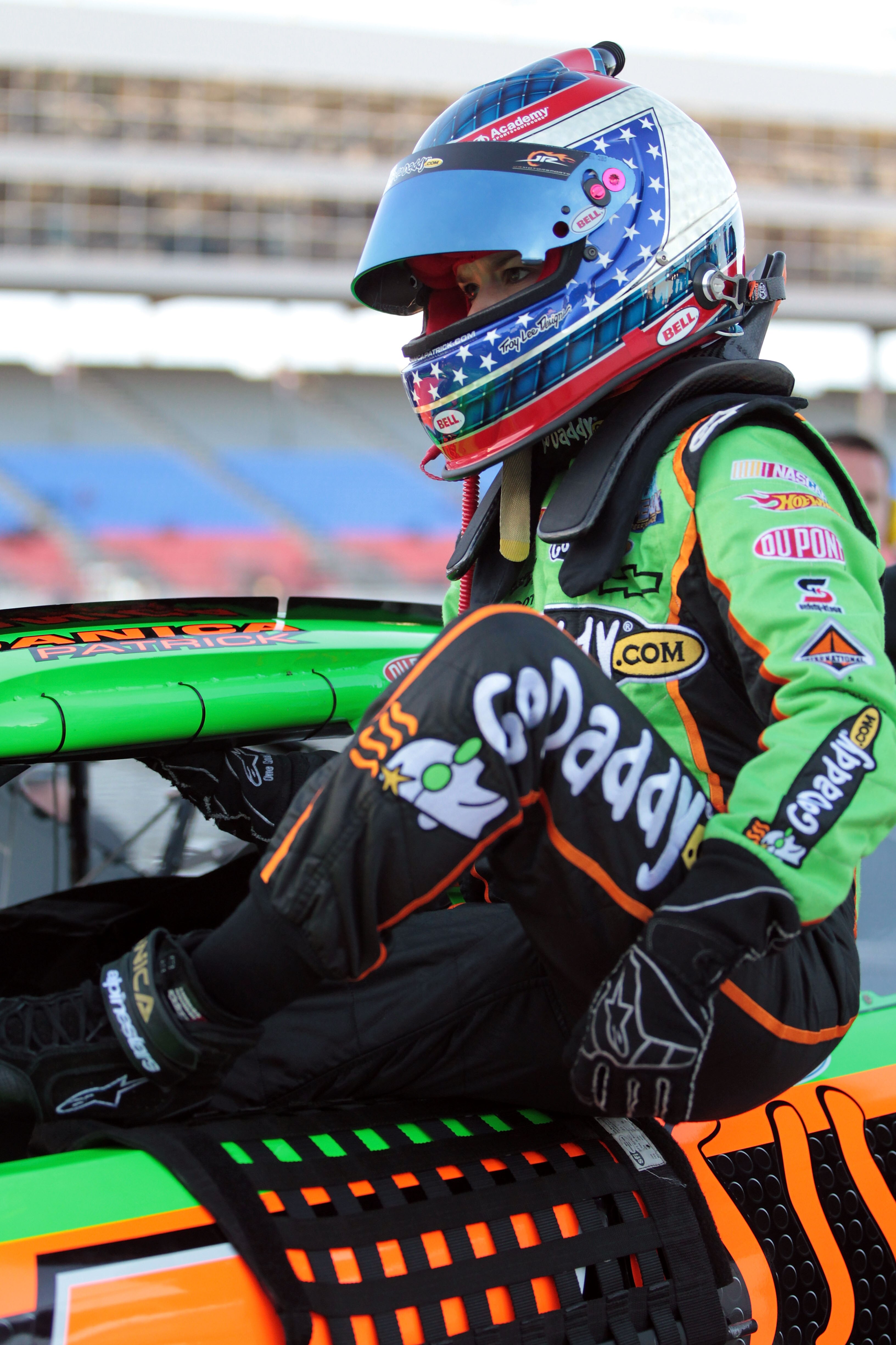 FORT WORTH, TX - NOVEMBER 05:  Danica Patrick, driver of the #7 GoDaddy.com Chevrolet, climbs out of her car after qualifying for the NASCAR Nationwide Series O'Reilly Auto Parts Challenge at Texas Motor Speedway on November 5, 2010 in Fort Worth, Texas.