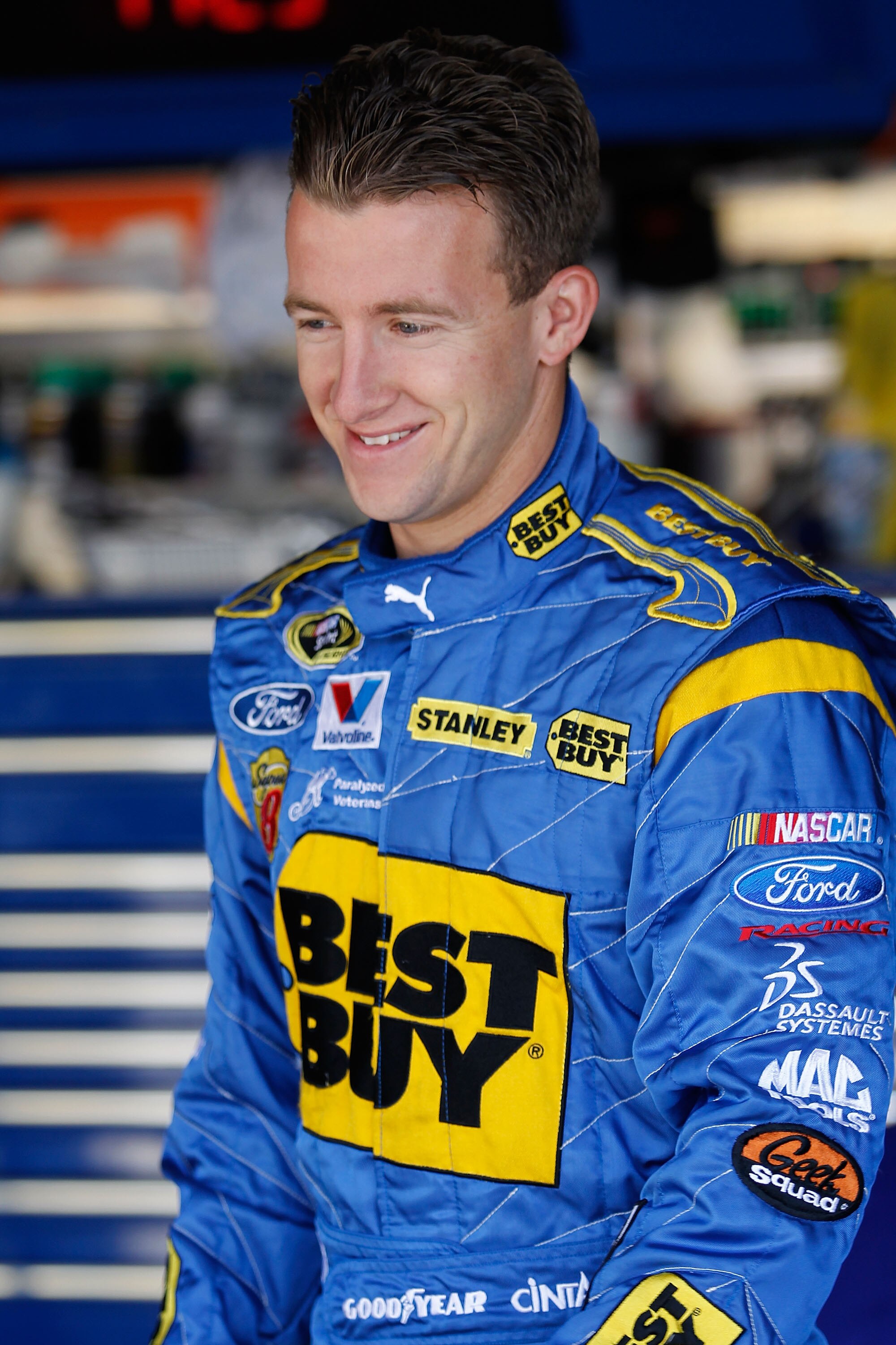 DOVER, DE - MAY 15:  AJ Allmendinger, driver of the #43 Richard Petty Hall of Fame Ford, walks in the garage during practice for the NASCAR Sprint Cup Series Autism Speaks 400 at Dover International Speedway on May 15, 2010 in Dover, Delaware.  (Photo by
