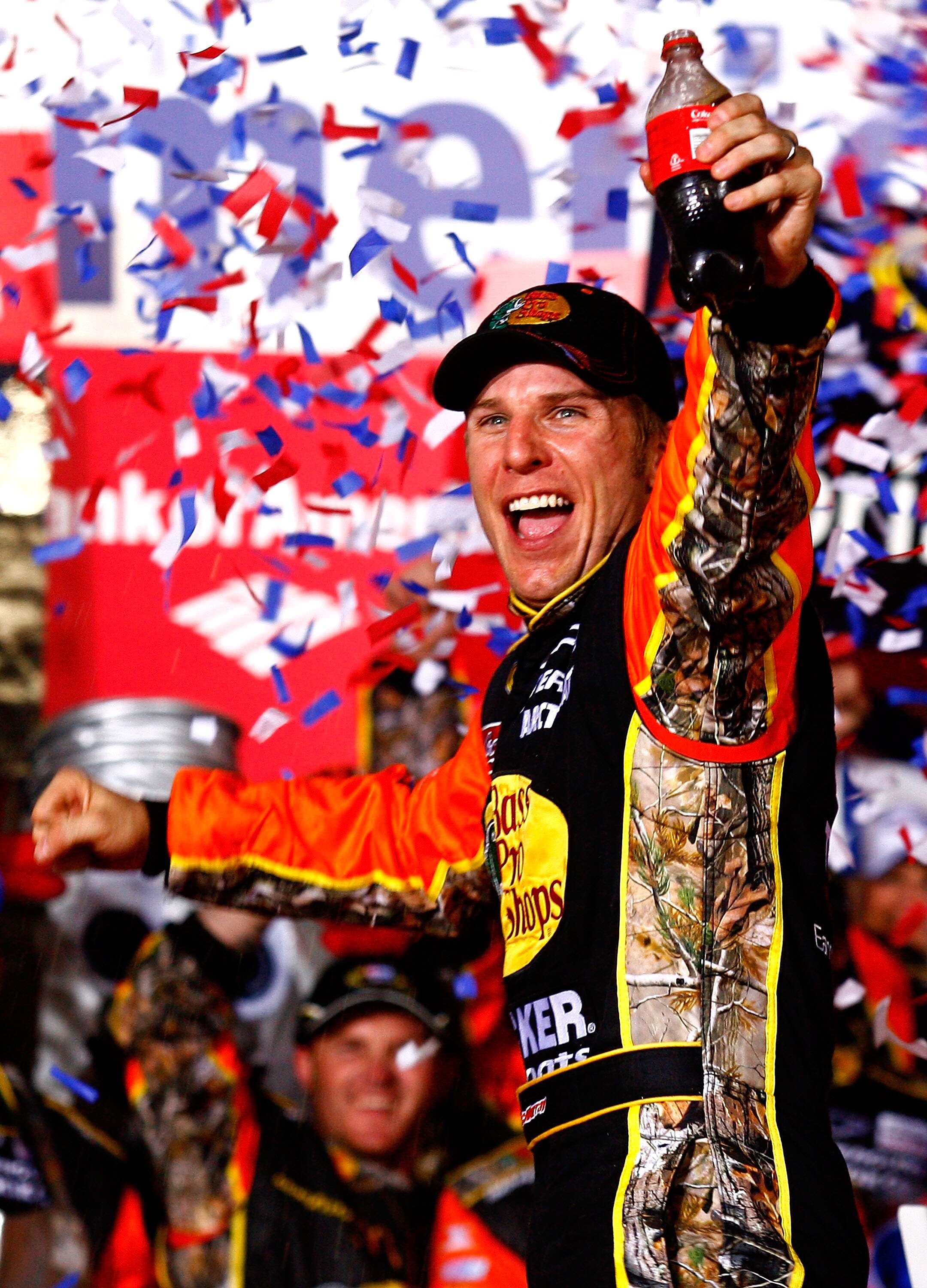 CONCORD, NC - OCTOBER 16:  Jamie McMurray, driver of the #1 Bass Pro Shops/Tracker Boats Chevrolet, celebrates in Victory Lane after winning the NASCAR Sprint Cup Series Bank of America 500 at Charlotte Motor Speedway on October 16, 2010 in Concord, North
