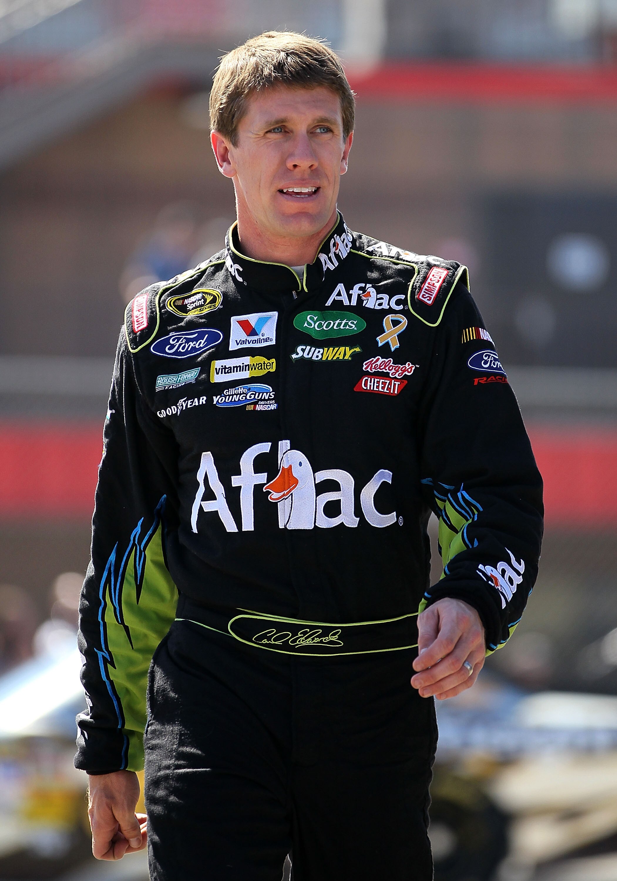 FONTANA, CA - OCTOBER 08:  Carl Edwards, driver of the #99 Aflac Ford, walks in the garage area during practice for the NASCAR Sprint Cup Series Pepsi Max 400 on October 8, 2010 in Fontana, California.  (Photo by Jeff Gross/Getty Images)