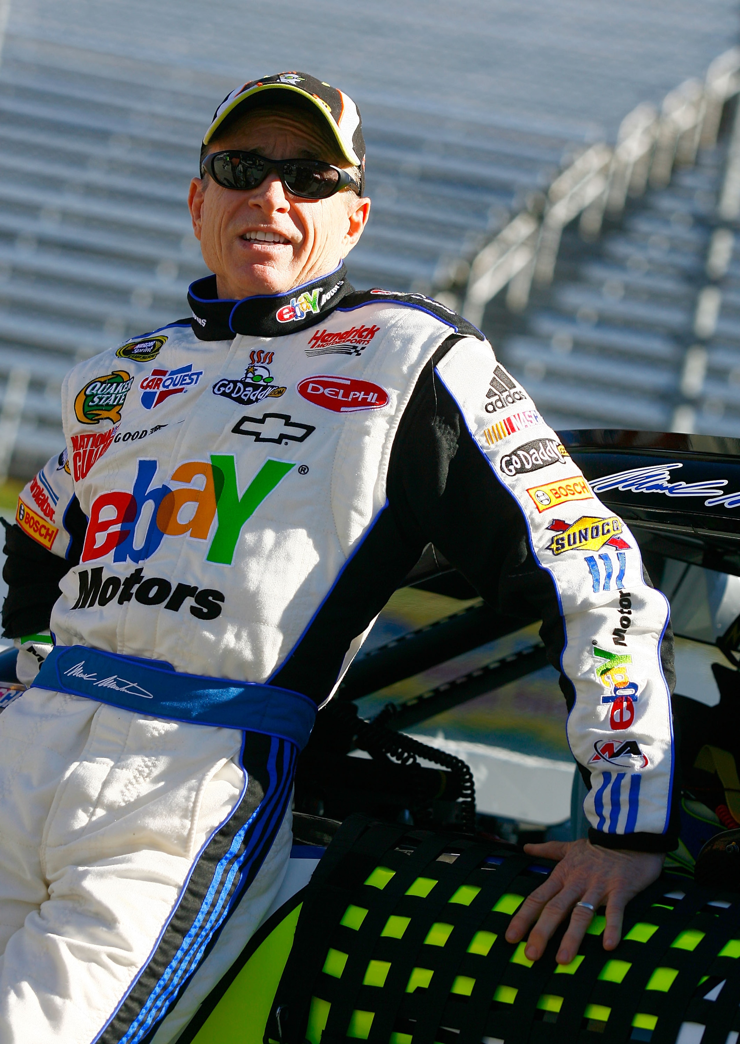 MARTINSVILLE, VA - OCTOBER 22:  Mark Martin, driver of the #5 ebay Motors/GoDaddy.com Chevrolet, stands next to his car on pit road during qualifying for the NASCAR Sprint Cup Series TUMS Fast Relief 500 at Martinsville Speedway on October 22, 2010 in Mar