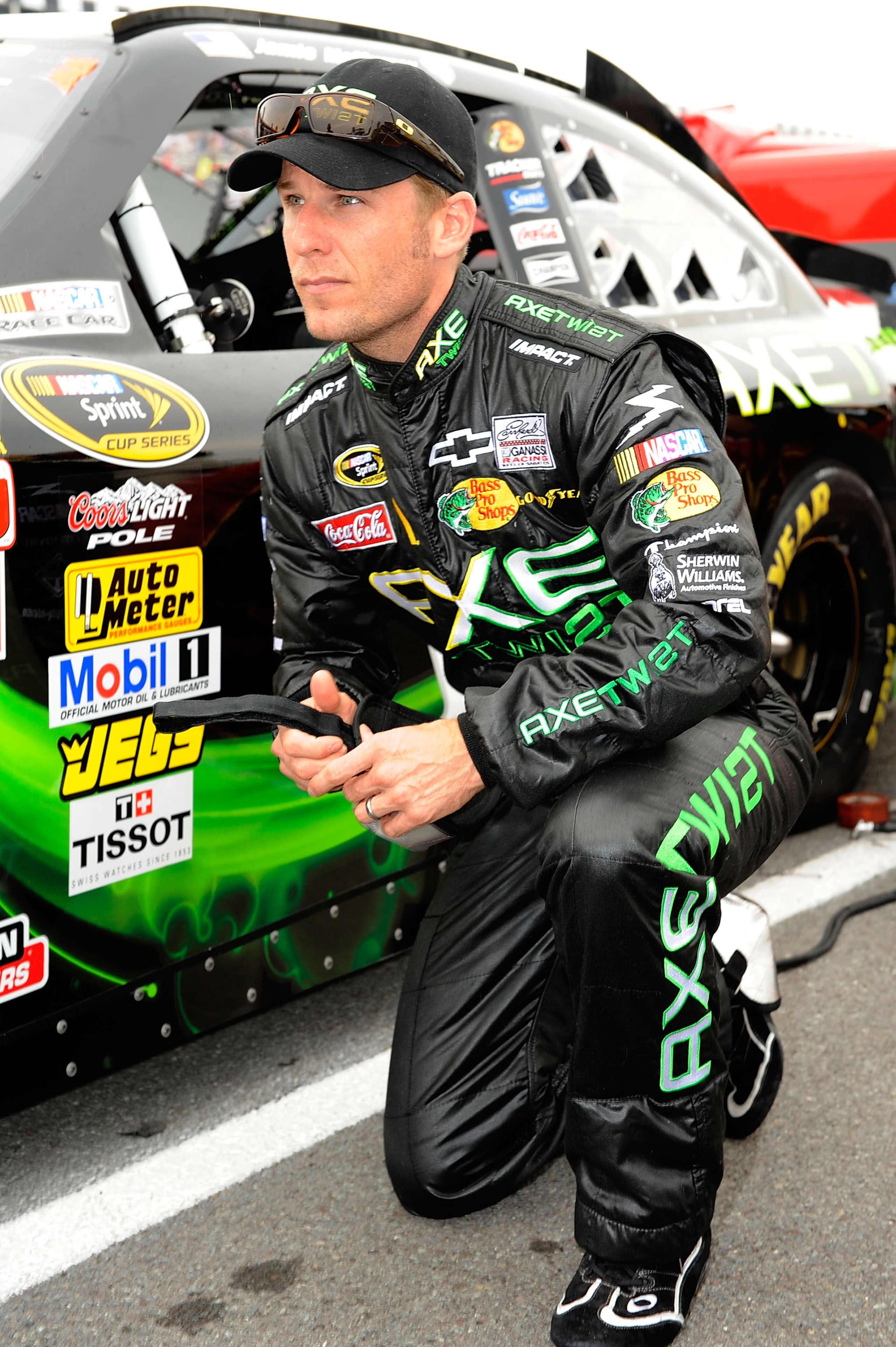 LONG POND, PA - AUGUST 01:  Jamie McMurray, driver of the #1 AXE Twist Chevrolet, kneels by his car prior to the NASCAR Sprint Cup Series Sunoco Red Cross Pennsylvania 500 at Pocono Raceway on August 1, 2010 in Long Pond, Pennsylvania.  (Photo by John Har