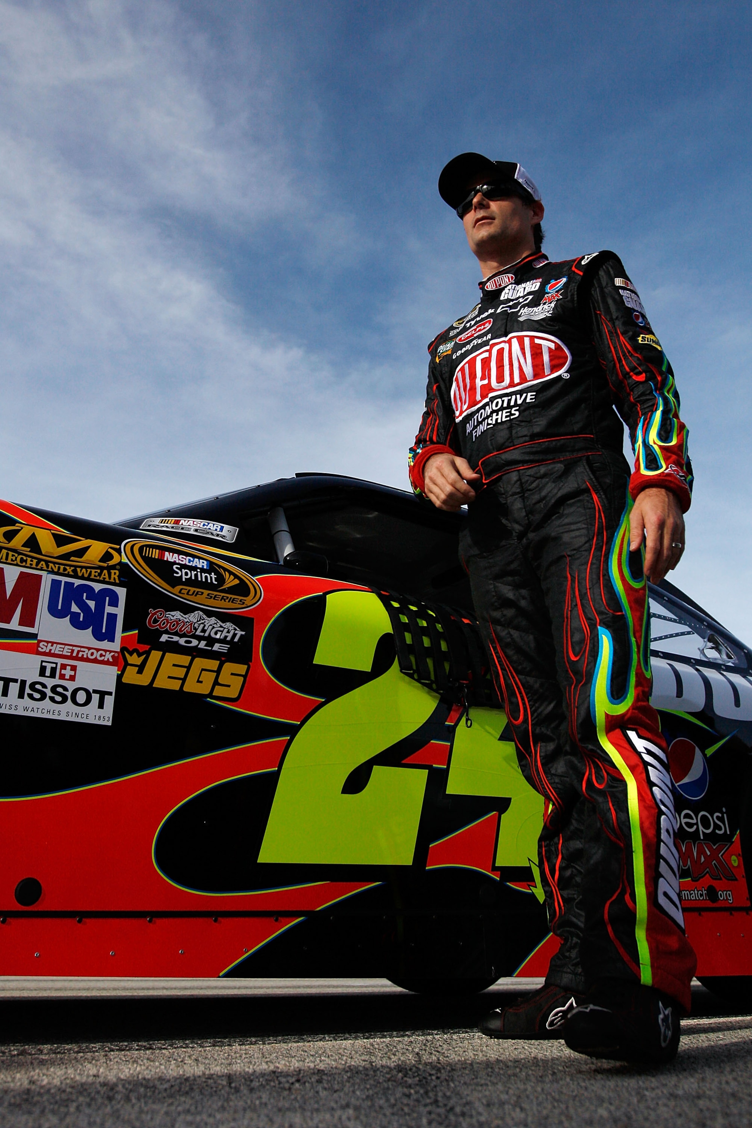 HOMESTEAD, FL - NOVEMBER 19:  Jeff Gordon, driver of the #24 DuPont Chevrolet, stands by his car after qualifying for the NASCAR Sprint Cup Series Ford 400 at Homestead-Miami Speedway on November 19, 2010 in Homestead, Florida.  (Photo by Chris Graythen/G