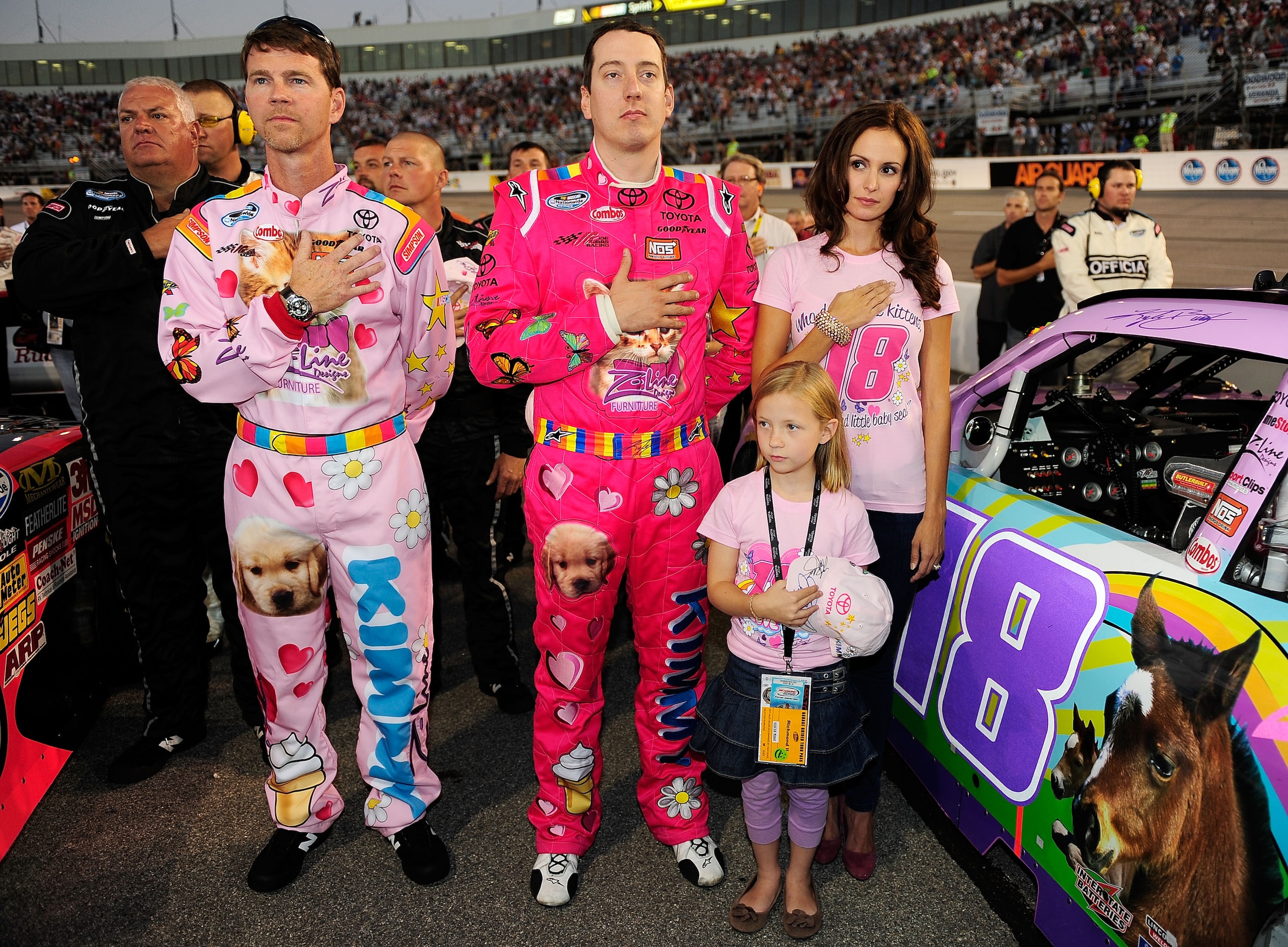RICHMOND, VA - SEPTEMBER 10:  Kyle Busch (C), driver of the #18 Toyota Kimmy/Z-Line Designs Toyota, his girlfriend Samantha Sarcinella (R) crew chief Jason Ratcliff (L) and contest winner Lennon Wynn (Bottom) stand on the grid prior to the NASCAR Nationwi