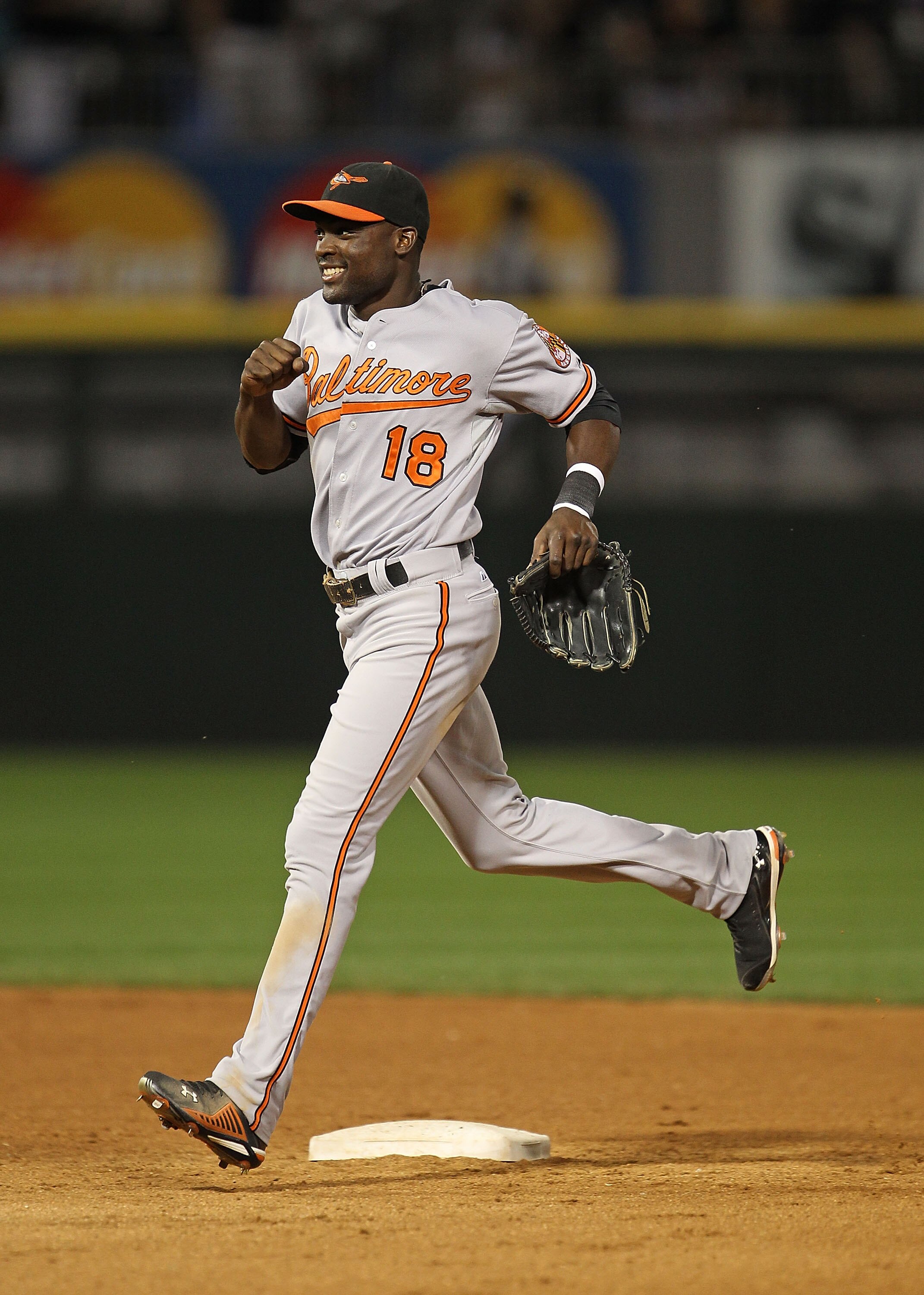 CHICAGO - AUGUST 25: Felix Pie #18 of the Baltimore Orioles runs off the field as he celebrates a win over the Chicago White Sox at U.S. Cellular Field on August 25, 2010 in Chicago, Illinois. The Orioles defeated the White Sox 4-3. (Photo by Jonathan Dan