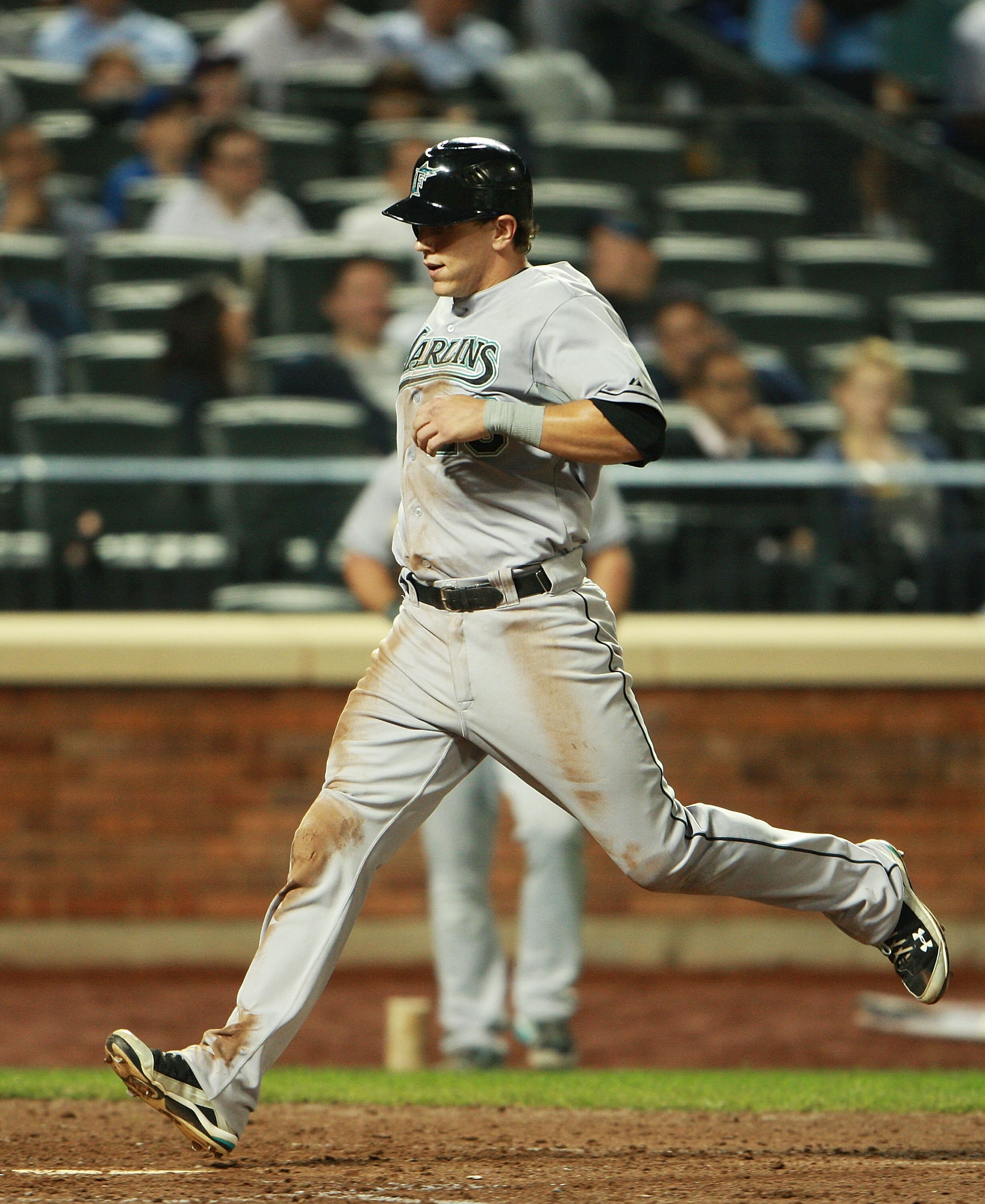 NEW YORK - AUGUST 25:  Logan Morrison #20 of the Florida Marlins scores a run off of a single hit by Hanley Ramirez #2 (not shown) in the seventh inning against the the New York Mets on August 25, 2010 at Citi Field in the Flushing neighborhood of the Que