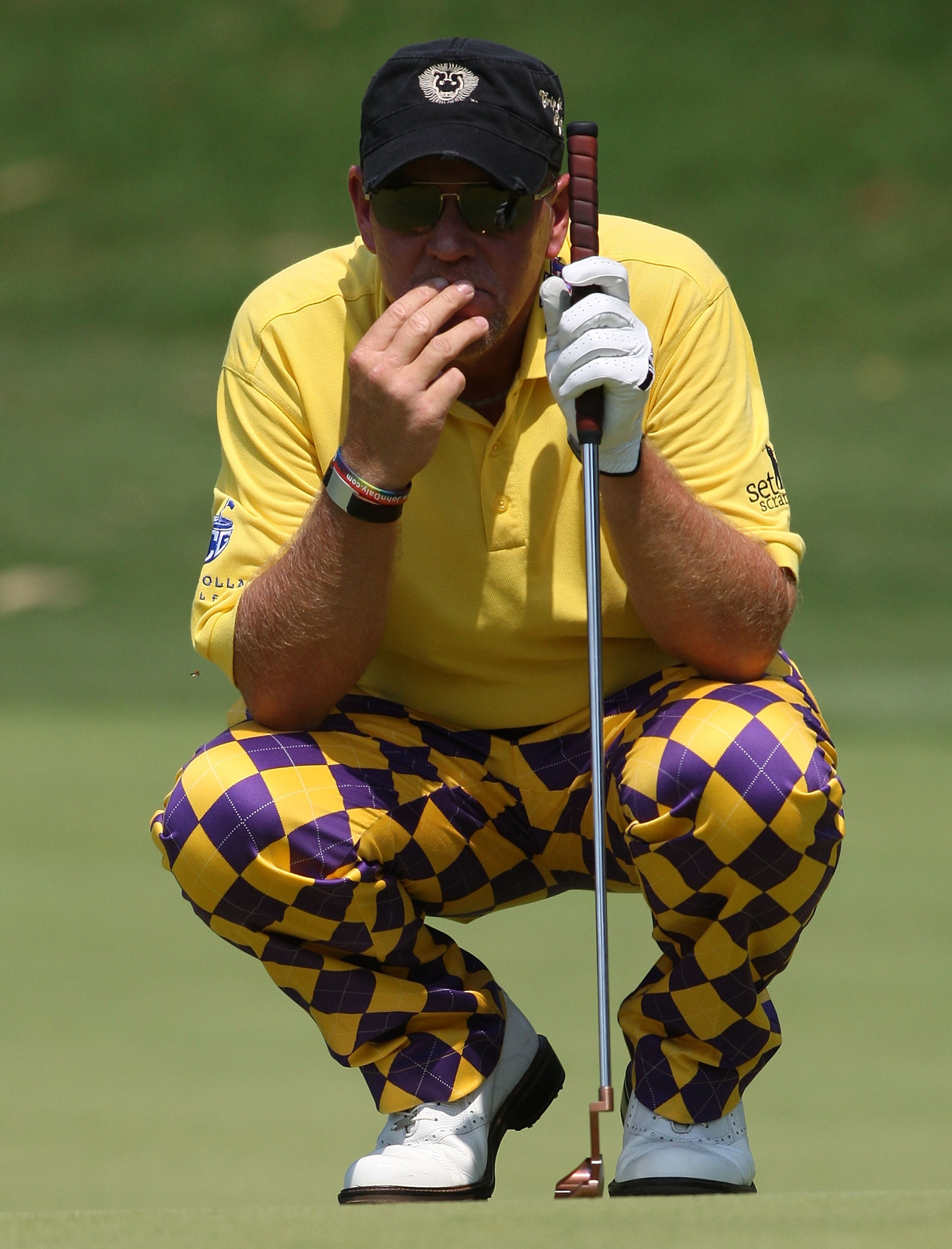 COOLUM, AUSTRALIA - DECEMBER 10: John Daly of the USA lines up a putt on the 13th hole during day one of the 2009 Australian PGA Championship at Hyatt Regency Resort, Coolum on December 10, 2009 at the Sunshine Coast, Australia.  (Photo by Bradley Kanaris
