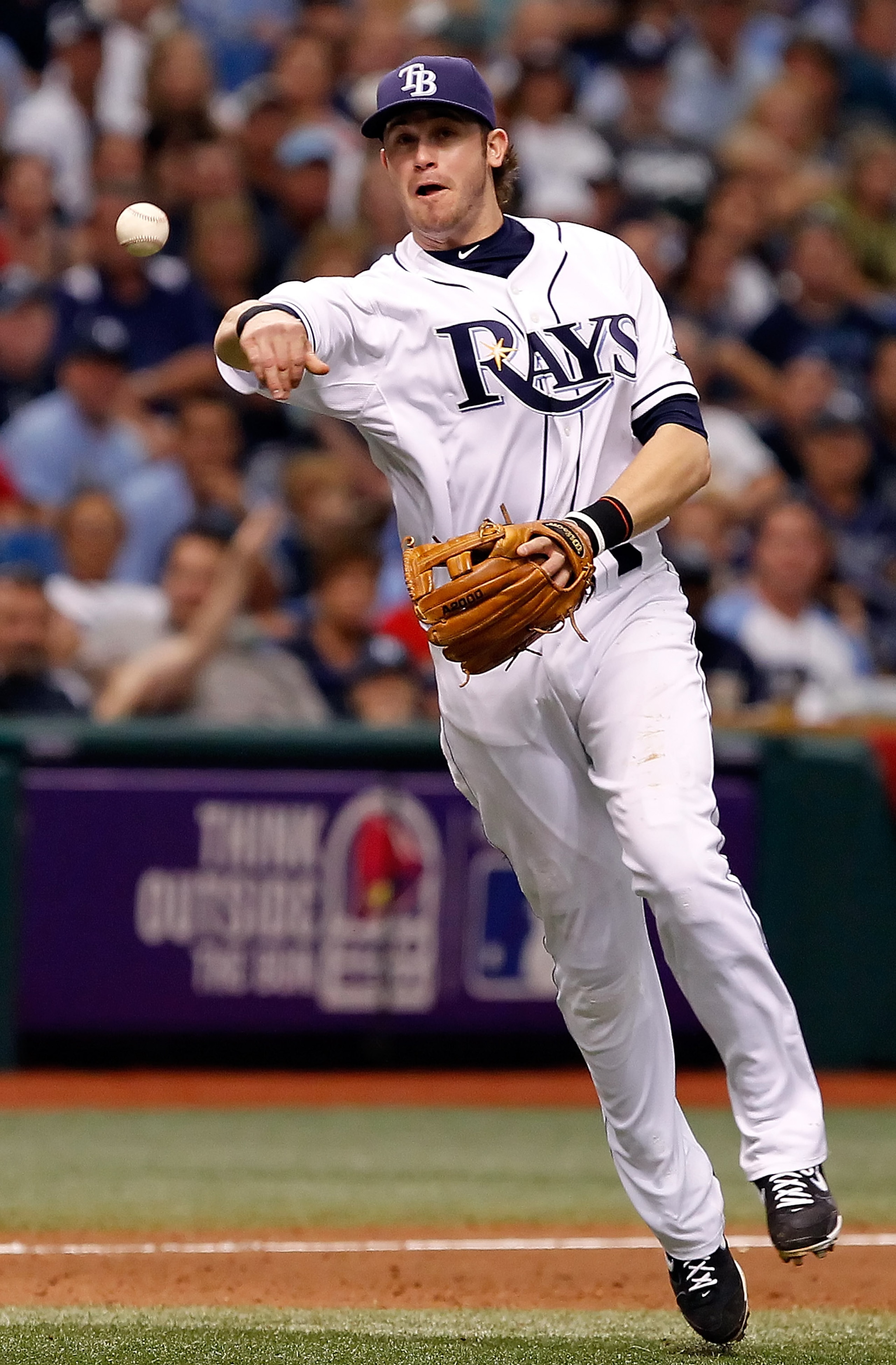 ST. PETERSBURG, FL - OCTOBER 06:  Infielder Evan Longoria #3 of the Tampa Bay Rays throws over to first for an out against the Texas Rangers during Game 1 of the ALDS at Tropicana Field on October 6, 2010 in St. Petersburg, Florida.  (Photo by J. Meric/Ge