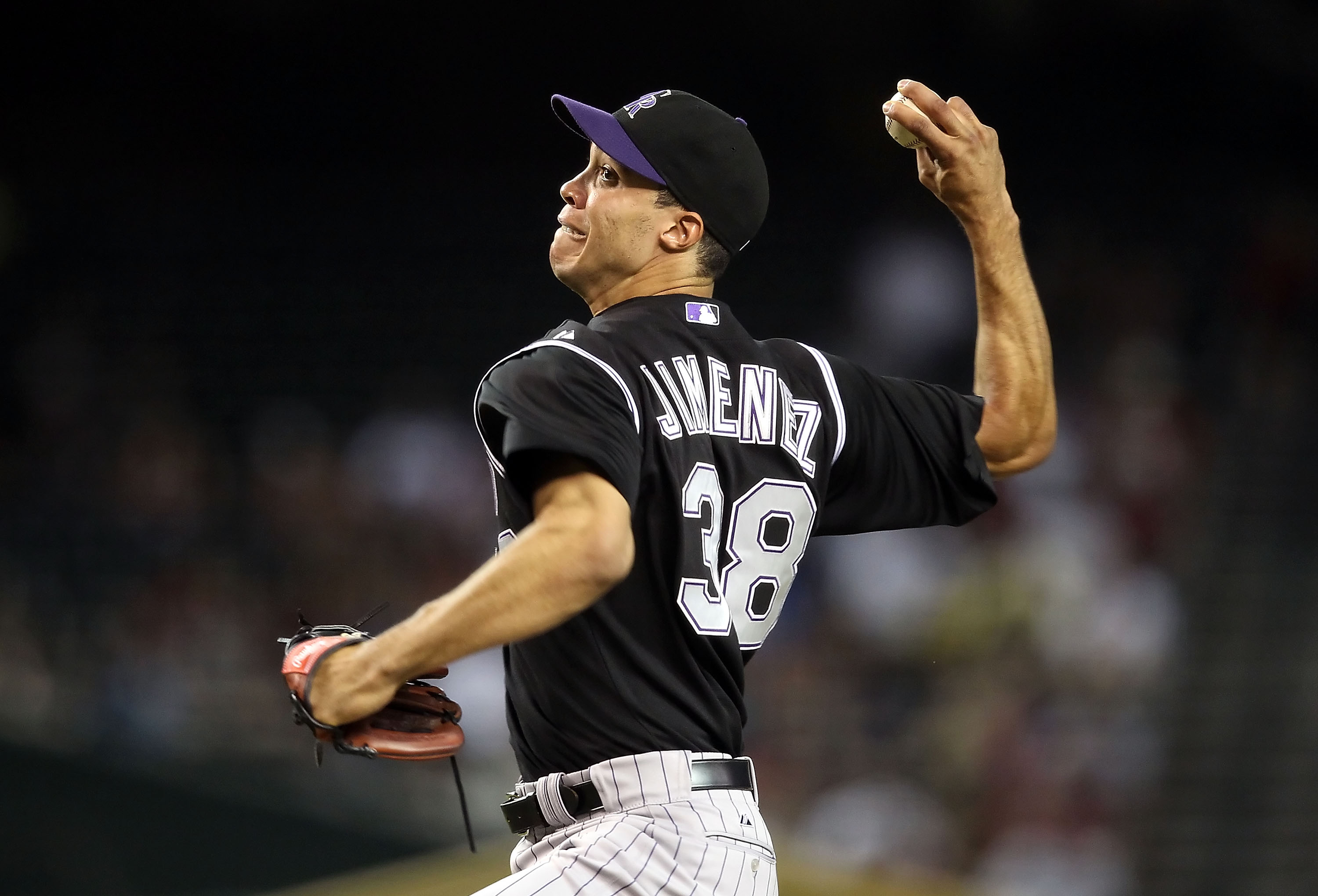 PHOENIX - SEPTEMBER 22:  Starting pitcher Ubaldo Jimenez #38 of the Colorado Rockies pitches against the Arizona Diamondbacks during the Major League Baseball game at Chase Field on September 22, 2010 in Phoenix, Arizona.  (Photo by Christian Petersen/Get