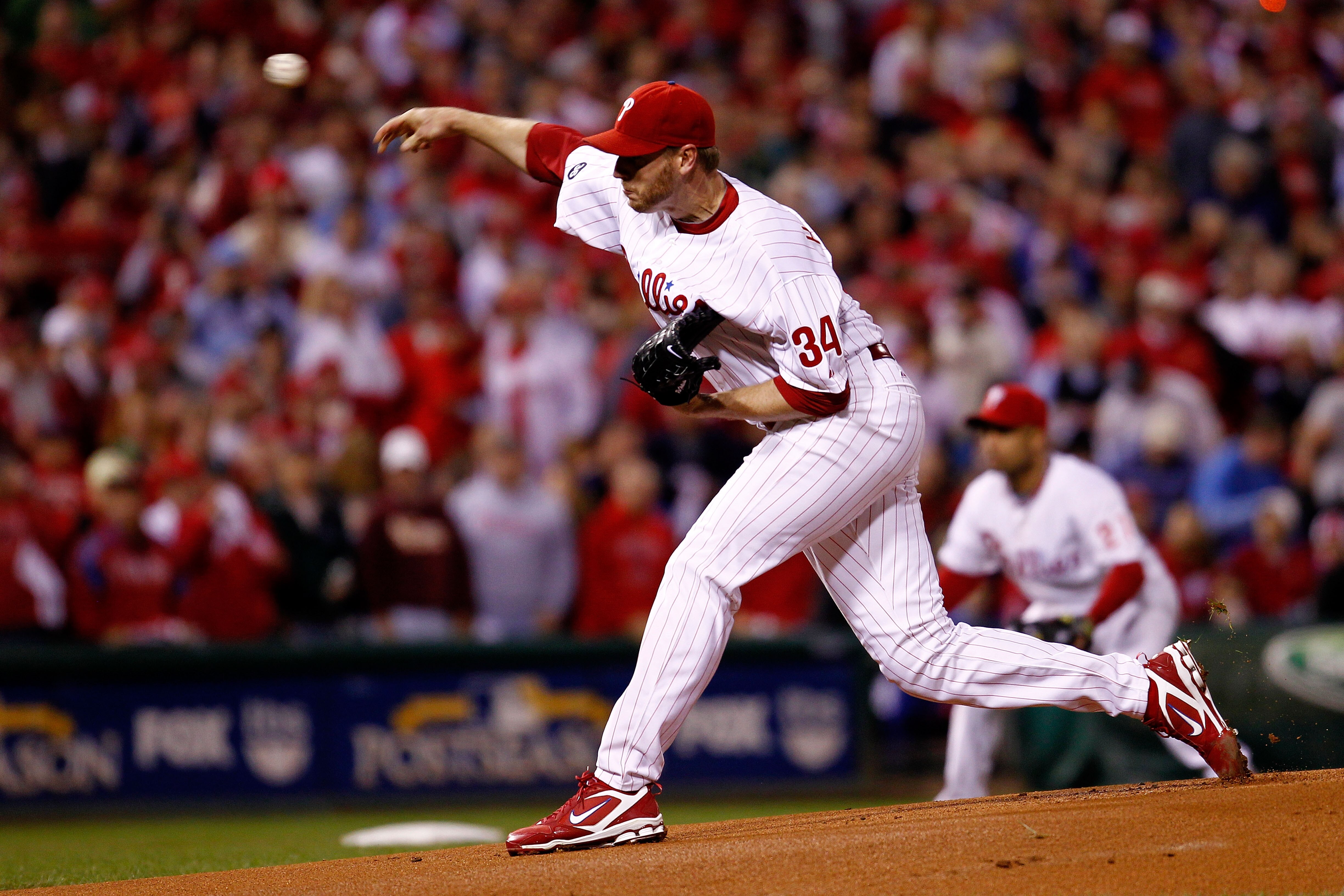 PHILADELPHIA - OCTOBER 16:  Roy Halladay #34 of the Philadelphia Phillies pitches in the first inning against the San Francisco Giants in Game One of the NLCS during the 2010 MLB Playoffs at Citizens Bank Park on October 16, 2010 in Philadelphia, Pennsylv