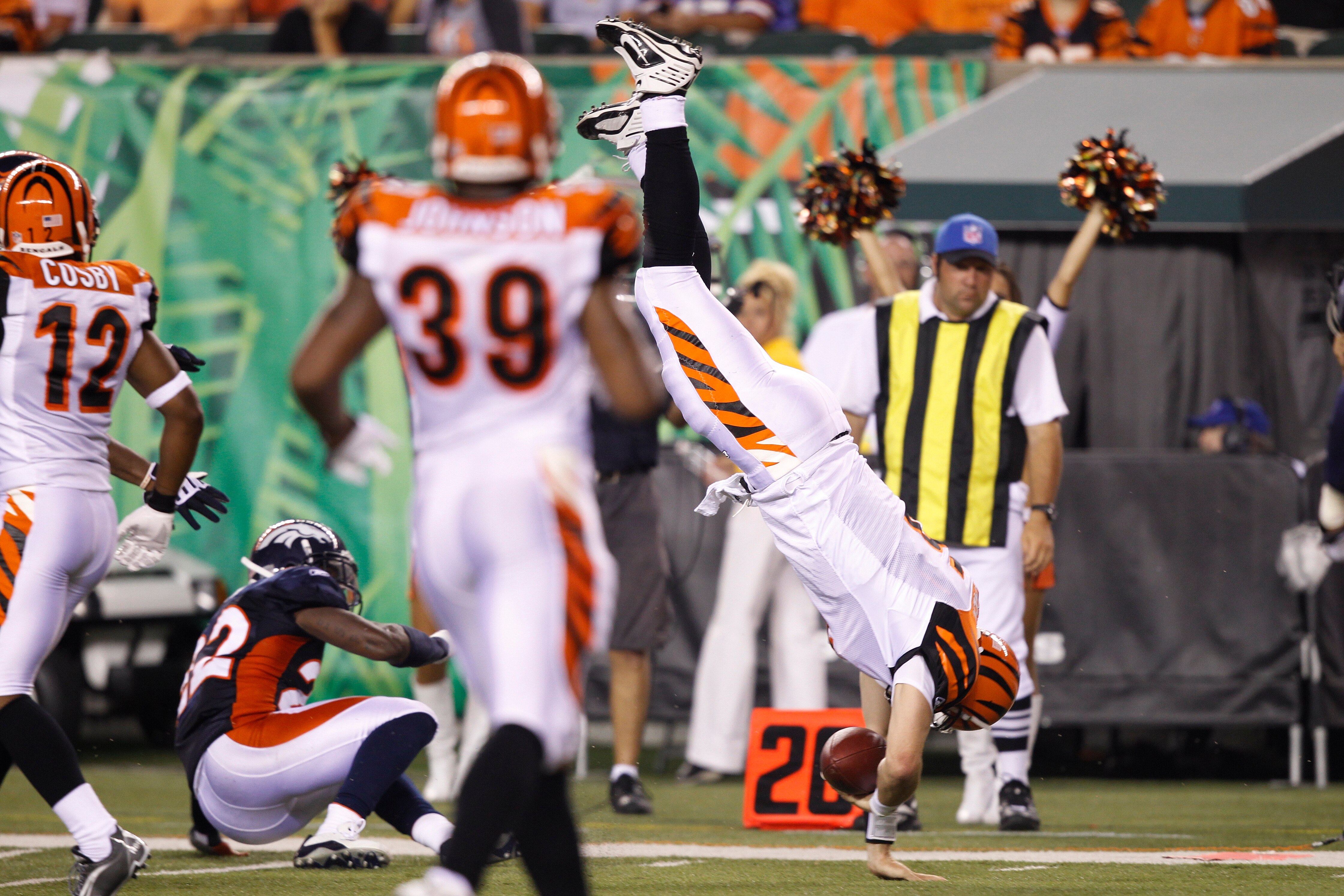 CINCINNATI, OH - AUGUST 15: Jordan Palmer #5 of the Cincinnati Bengals dives and flips while running the ball against the Denver Broncos during a preseason game at Paul Brown Stadium on August 15, 2010 in Cincinnati, Ohio. The Bengals won 33-24. (Photo by