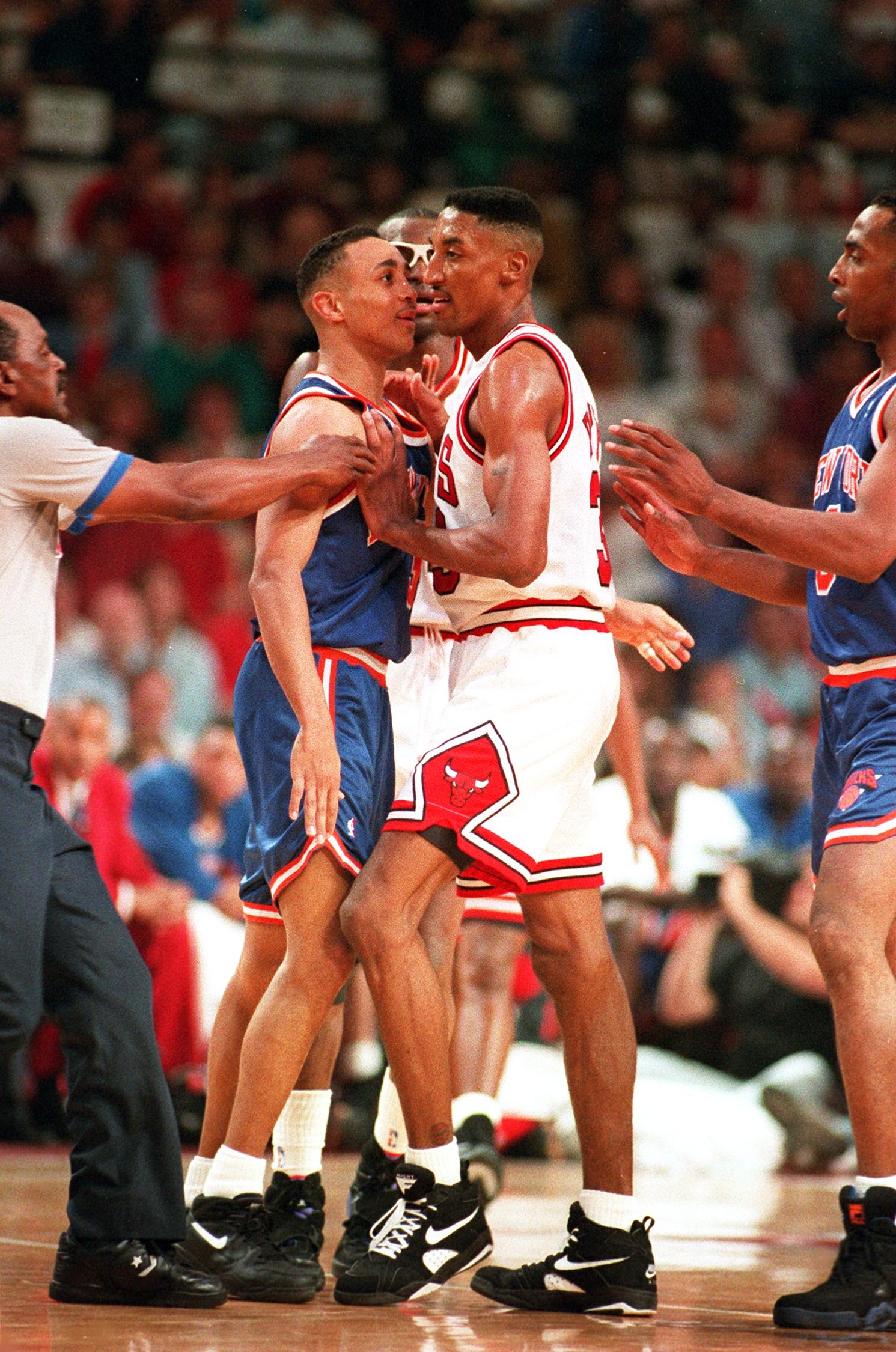 JUN 1993:  A REFEREE AND HORACE GRANT TRY TO BREAK UP AN ALTERCATION BETWEEN NEW YORK'S JOHN STARKS AND CHICAGO'S SCOTTIE PIPPEN DURING THE BULLS 103-83 VICTORY OVER THE KNICKS IN THE NBA EASTERN CONFERENCE FINALS. Mandatory Credit: Jonathan Daniel/ALLSPO