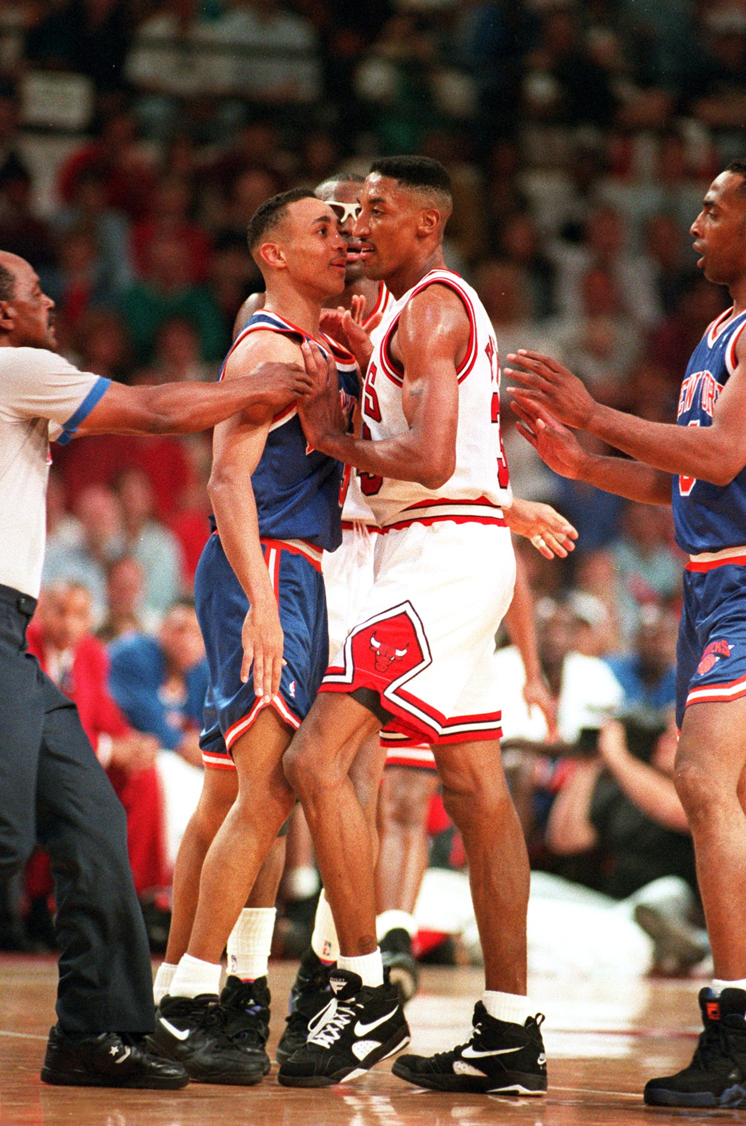 JUN 1993:  A REFEREE AND HORACE GRANT TRY TO BREAK UP AN ALTERCATION BETWEEN NEW YORK'S JOHN STARKS AND CHICAGO'S SCOTTIE PIPPEN DURING THE BULLS 103-83 VICTORY OVER THE KNICKS IN THE NBA EASTERN CONFERENCE FINALS. Mandatory Credit: Jonathan Daniel/ALLSPO