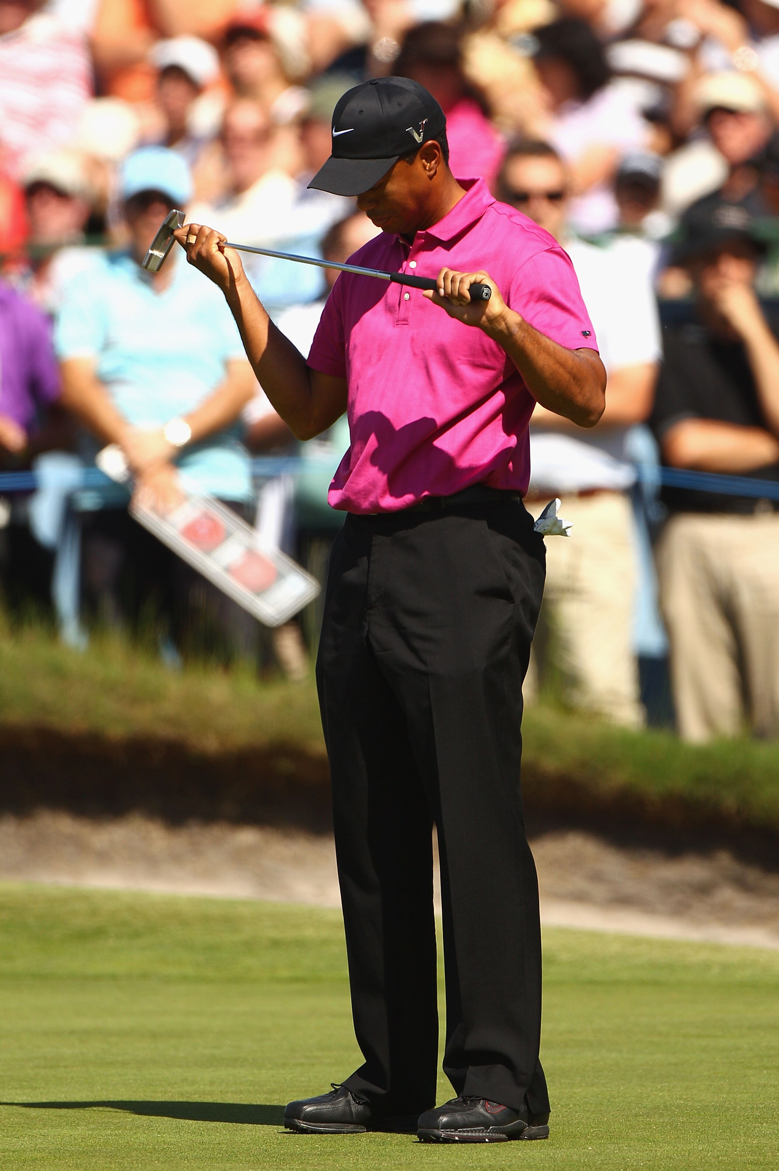 MELBOURNE, AUSTRALIA - NOVEMBER 11:  Tiger Woods of the USA looks at his putter after missing a putt during day one of the Australian Masters at The Victoria Golf Club on November 11, 2010 in Melbourne, Australia.  (Photo by Ryan Pierse/Getty Images)