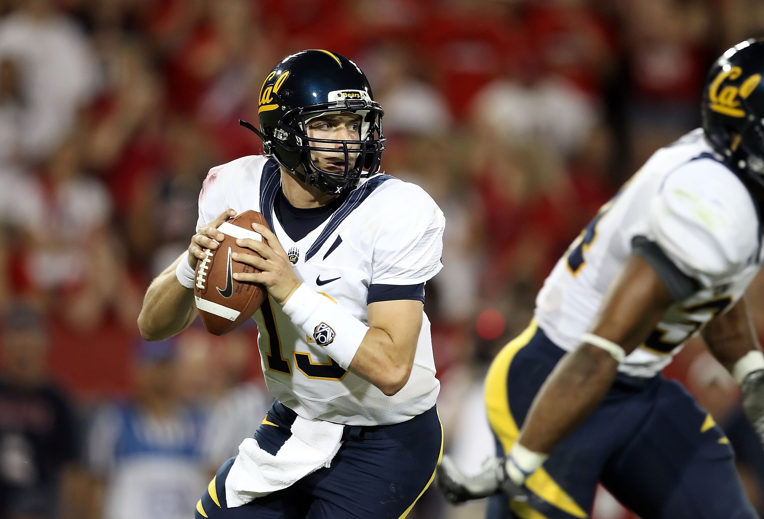 TUCSON, AZ - SEPTEMBER 25:  Quarterback Kevin Riley #13 of the California Golden Bears drops back to pass during the college football game against the Arizona Wildcats at Arizona Stadium on September 25, 2010 in Tucson, Arizona. The Wildcats defeated the