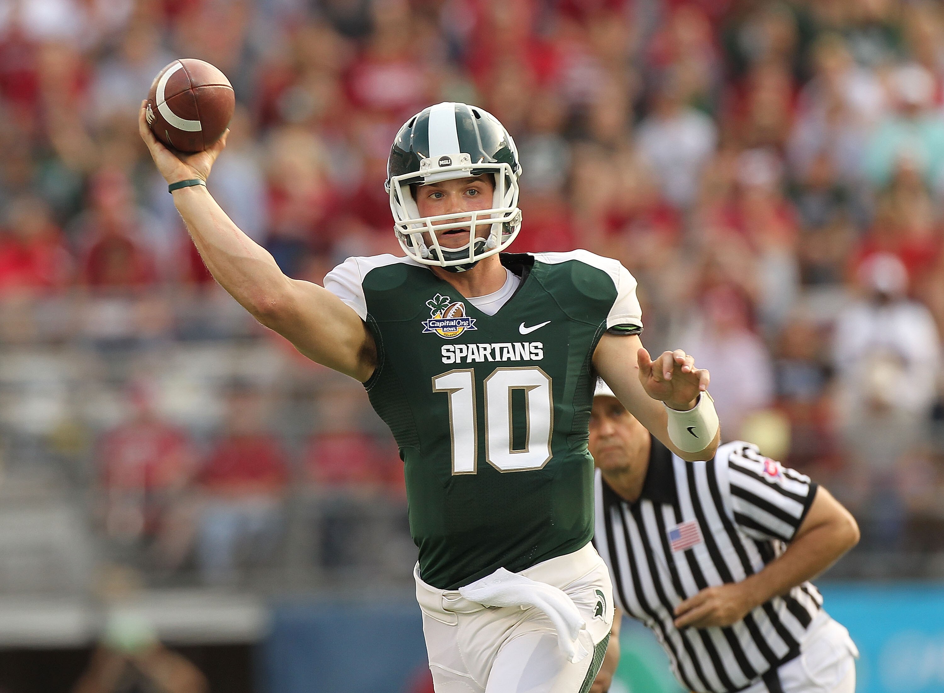 ORLANDO, FL - JANUARY 01: Andrew Maxwell #10 of the Michigan State Spartans passes the ball during the Capitol One Bowl against the Alabama Crimson Tide at the Florida Citrus Bowl on January 1, 2011 in Orlando, Florida.  (Photo by Mike Ehrmann/Getty Image